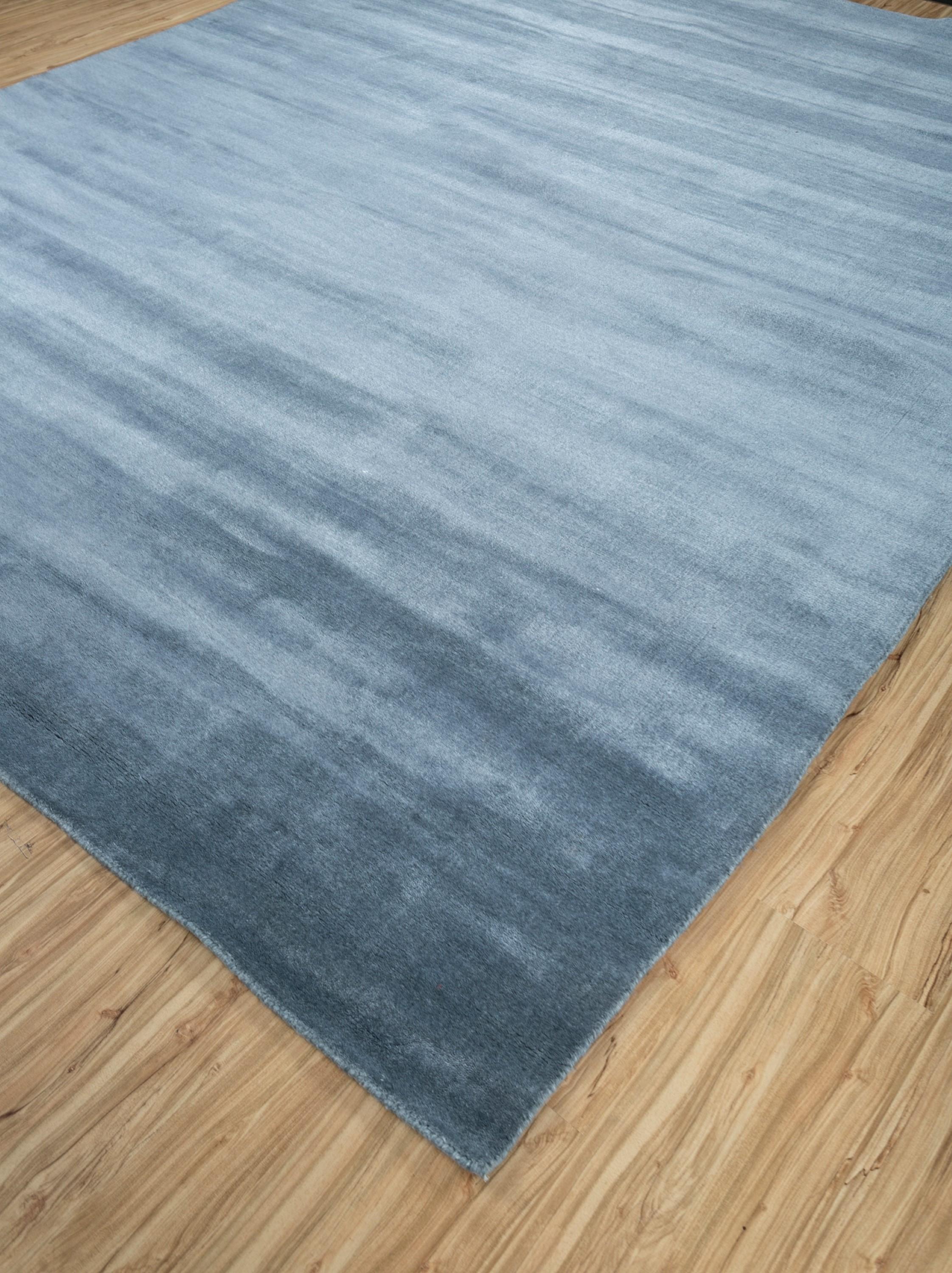 Immerse your space in modern elegance with the handloom rug, a masterpiece crafted in the heart of rural India. Unveiling the intricate patterns inspired by microscopic wonders, this rug is a testament to artistry. Meticulously handmade, the durable