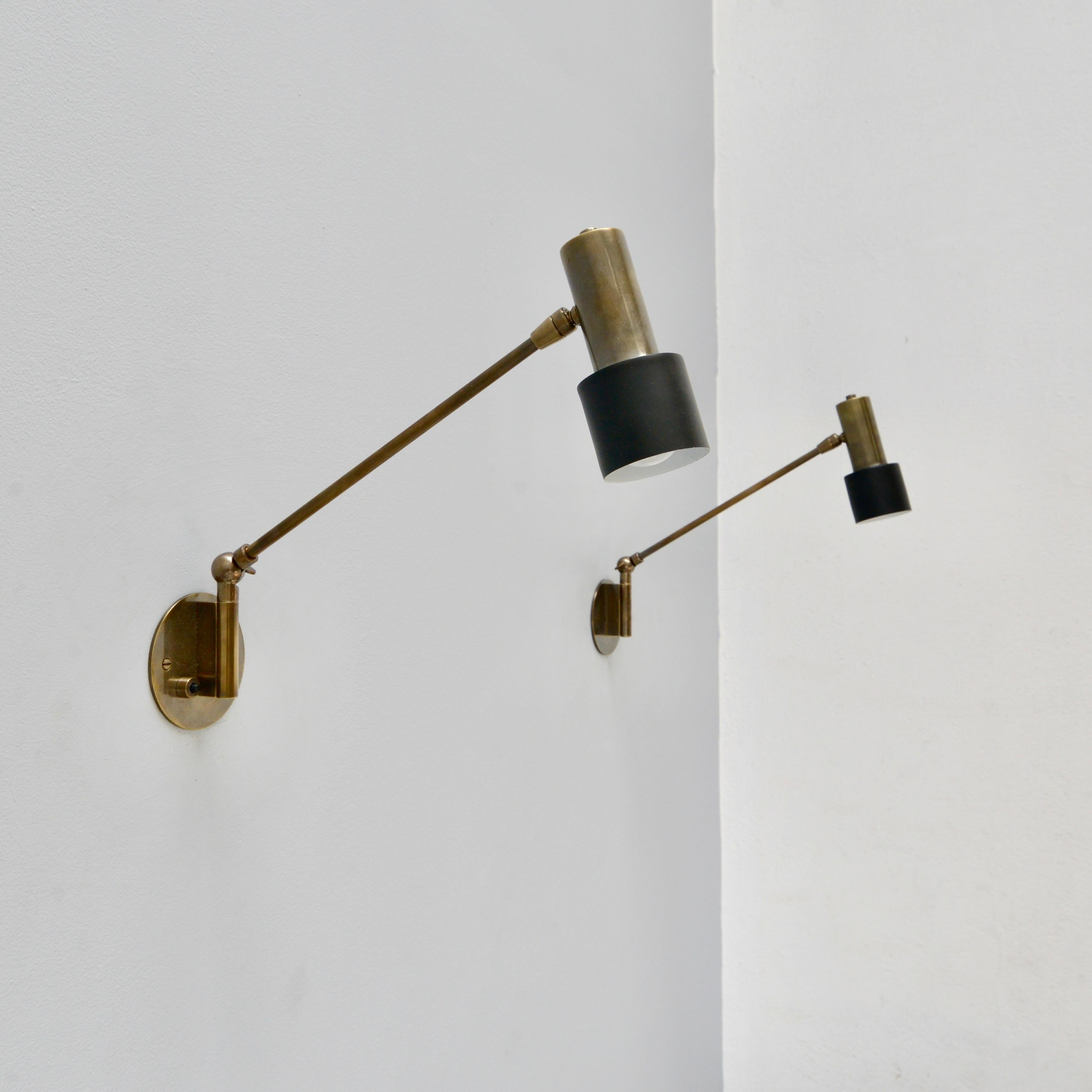Beautiful patinated brass MicroLU Full Swing (FS) articulating wall sconce by Lumfardo Luminaires. Made contemporary in the US. In all brass patinated finish with push switch. Multiples available for order. Wired with (1) E26 medium based socket. It