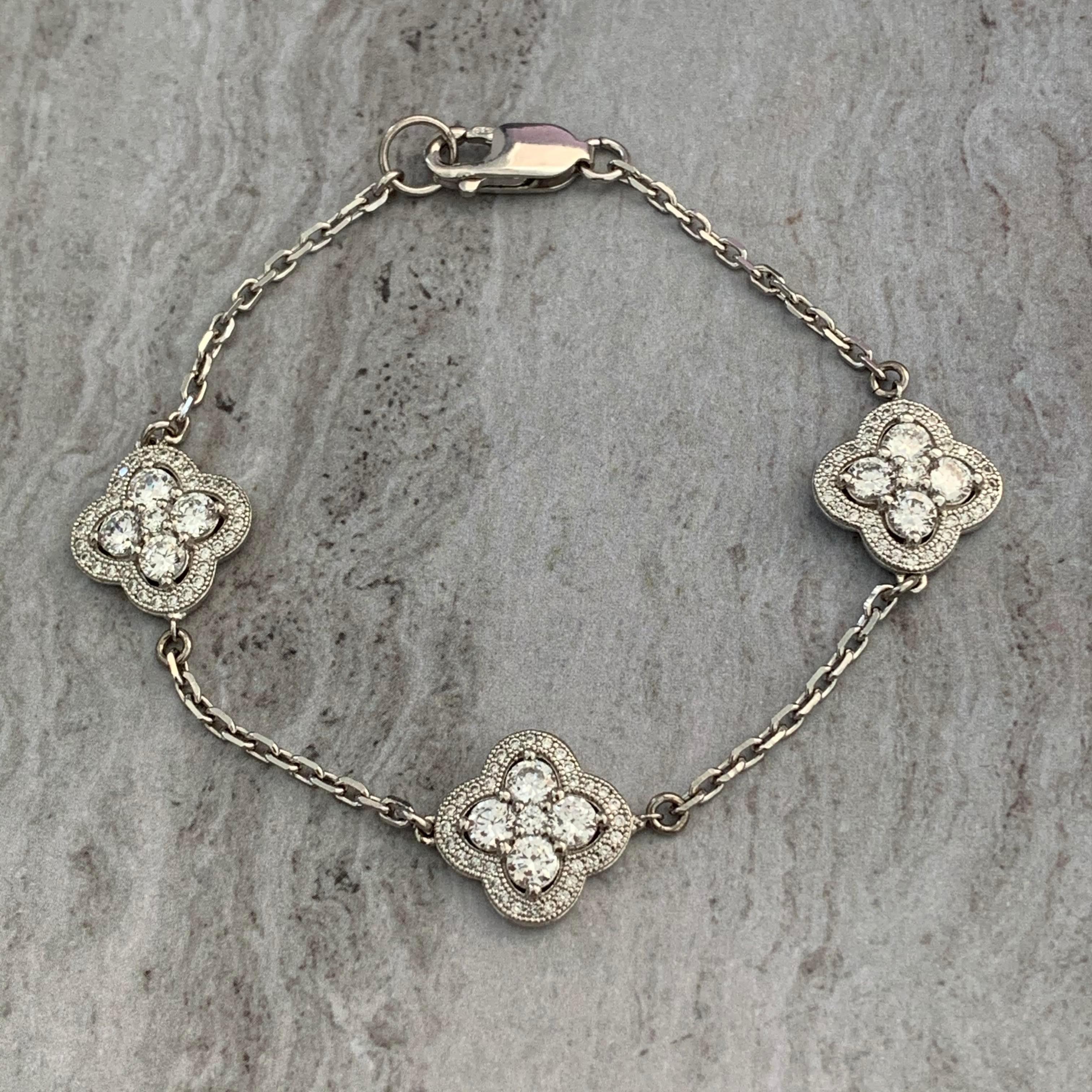 Bijoux Num Micropave Faux Diamond Clover Sterling Silver Station Bracelet

This beautiful bracelet features 3 pieces of micropave-set faux diamond cubic zirconia clover, interconnect with faceted chain, and lobster claw closure. The metal is