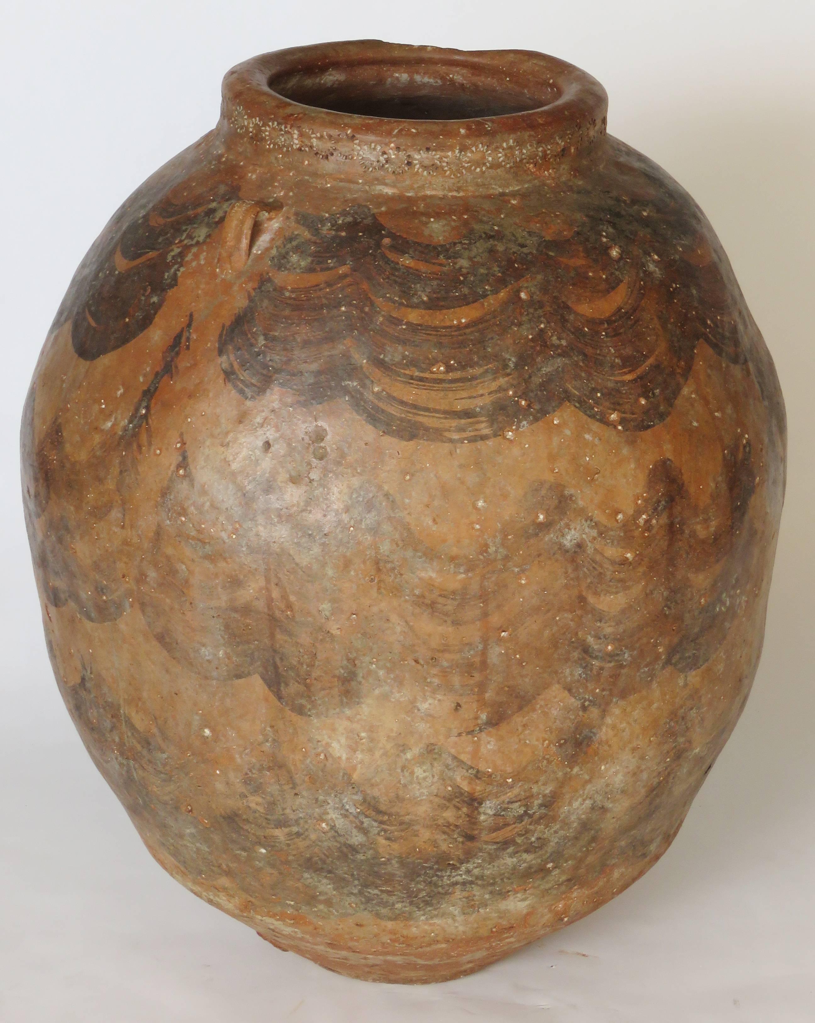 Hand coiled painted terracotta jar with handles. Mouth: 10