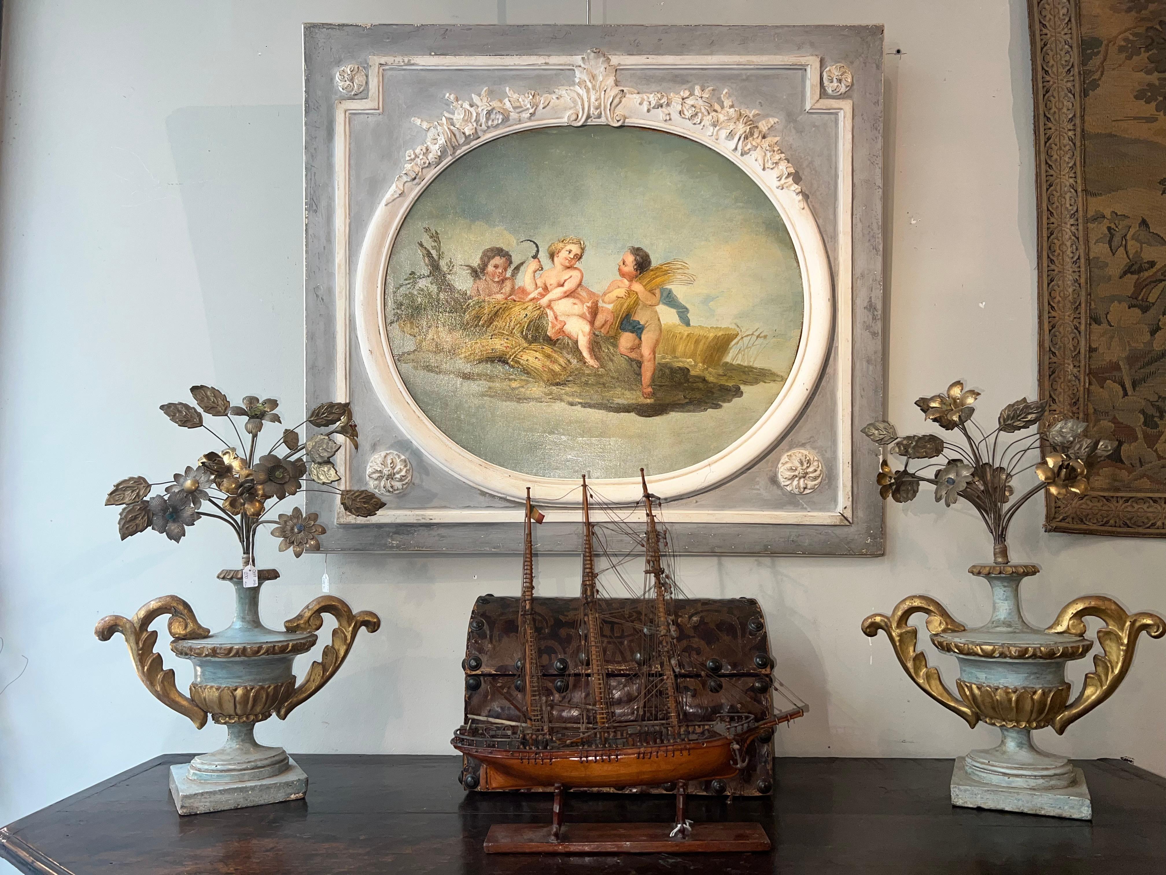 Beautiful oil painting on canvas depicting the allegory of Summer.
Piedmontese school from the end of the 1700s, within a wooden frame and tablet carved with floral and vegetable motifs, painted in shades of gray and white.

MEASUREMENTS: Overall