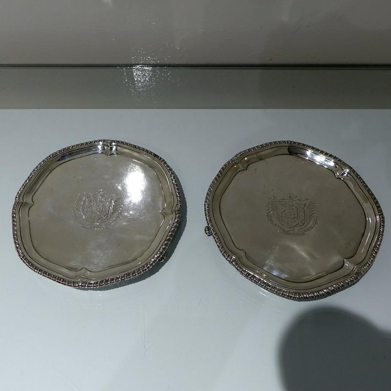 A splendid pair of mid-18th century shaped circular salvers decorated with an outer gadroon border for highlights. The centre fronts have stylish contemporary armorials for importance.

 

Weight: 23.9 troy ounces/744 grams

Measures: Diameter