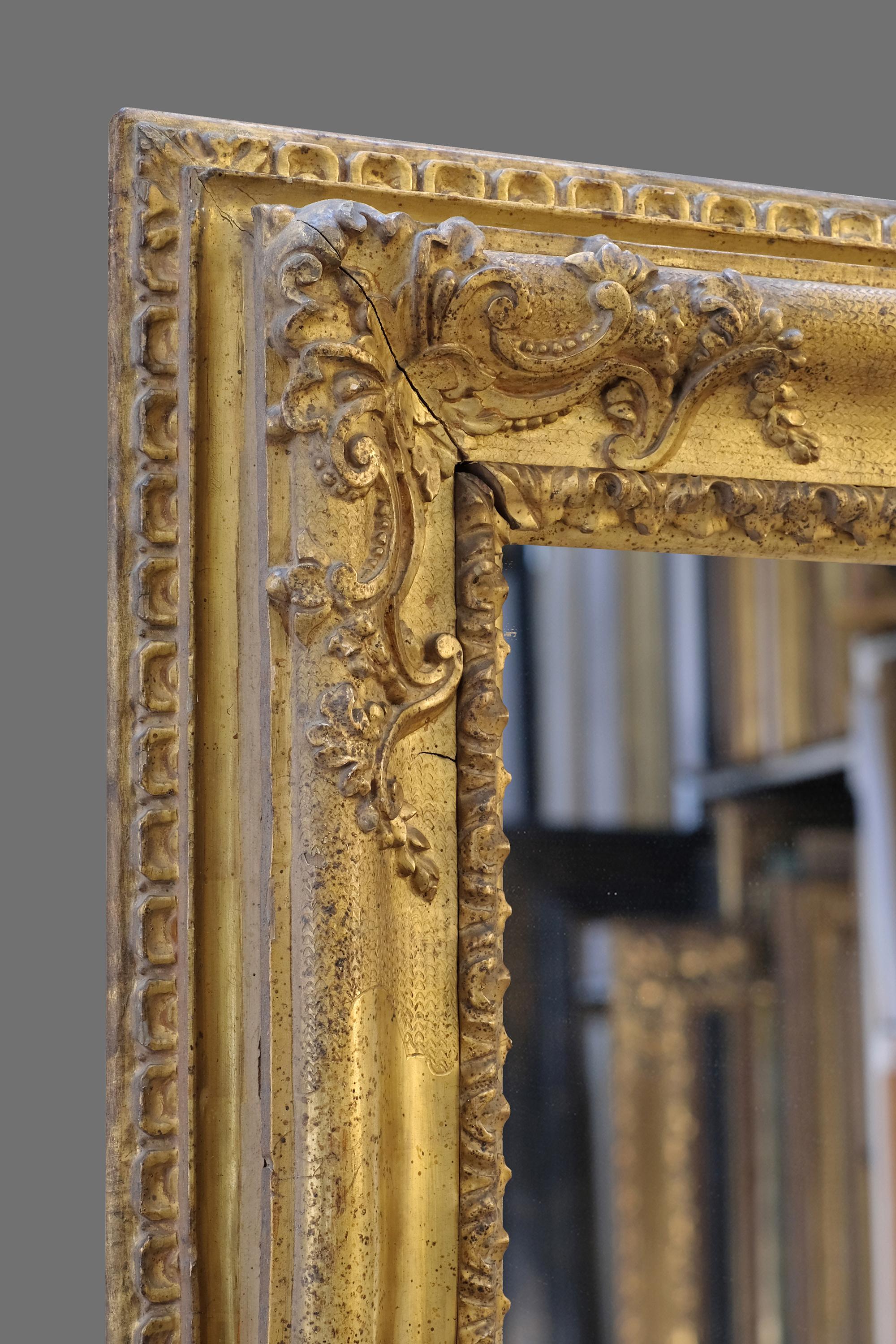 This is an exceptionally rare and exquisite hand carved mid 18th century Italian - Piedmontese late Baroque frame. It has an ogee profile with carved sight leaf-&-tongue; corner-&-centre cartouches with foliate and beaded strap work on a hazzled