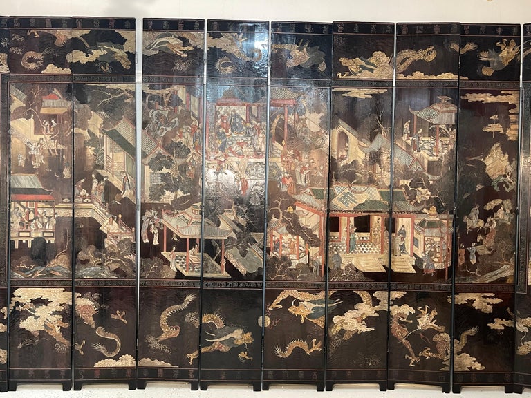 Finest mid-18th century Chinese coromandel ten fold screen. The border with dragon motif and the center with pagodas, landscapes and various domestic scenes with court of noblemen and musicians on deep plum background. The reverse side with border