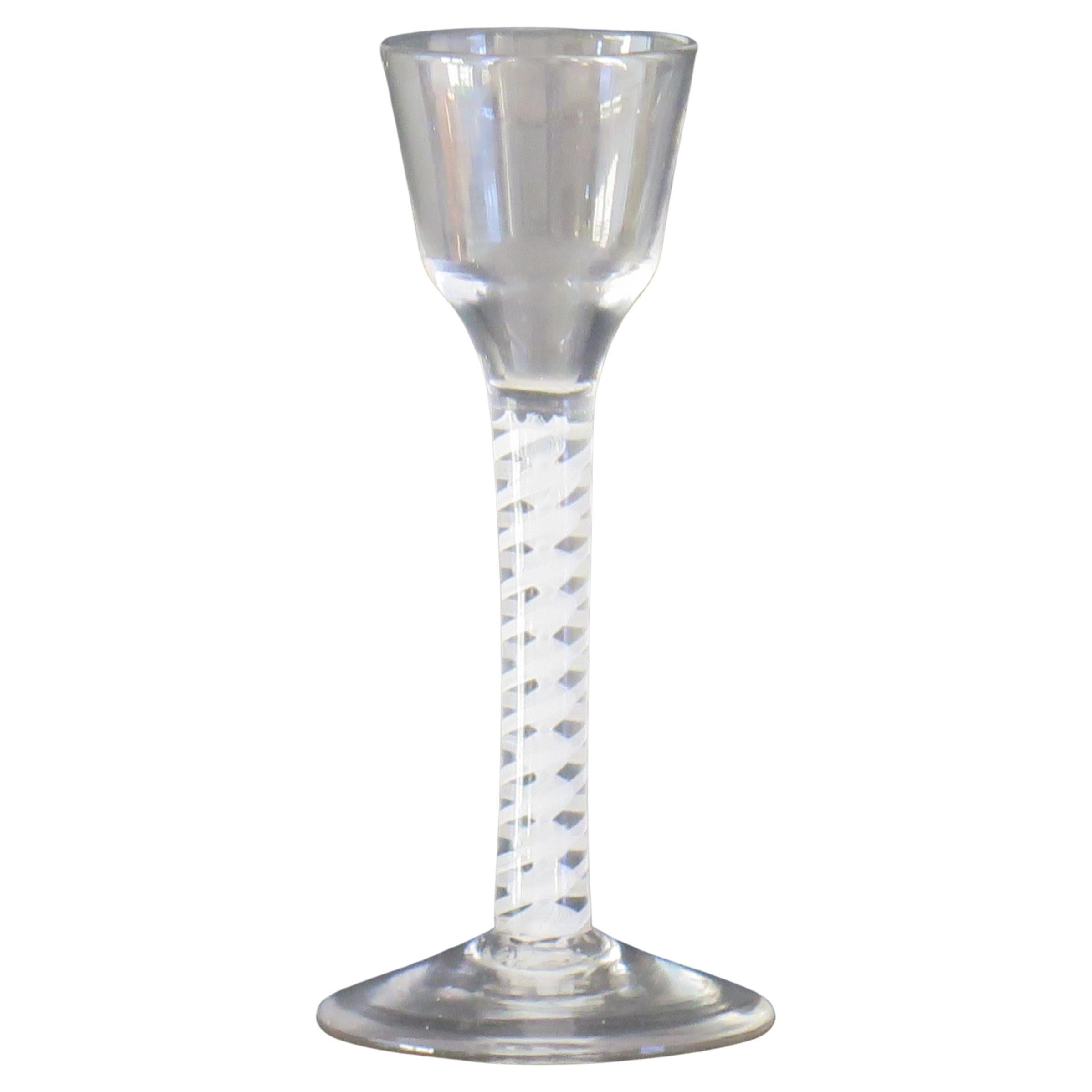 This is a good hand blown, English, mid-Georgian, Cordial drinking glass with a double series opaque twist (DSOT) stem, dating from the middle of the 18th century, circa 1765.

These glasses are very collectable, with cordial glasses being rarer