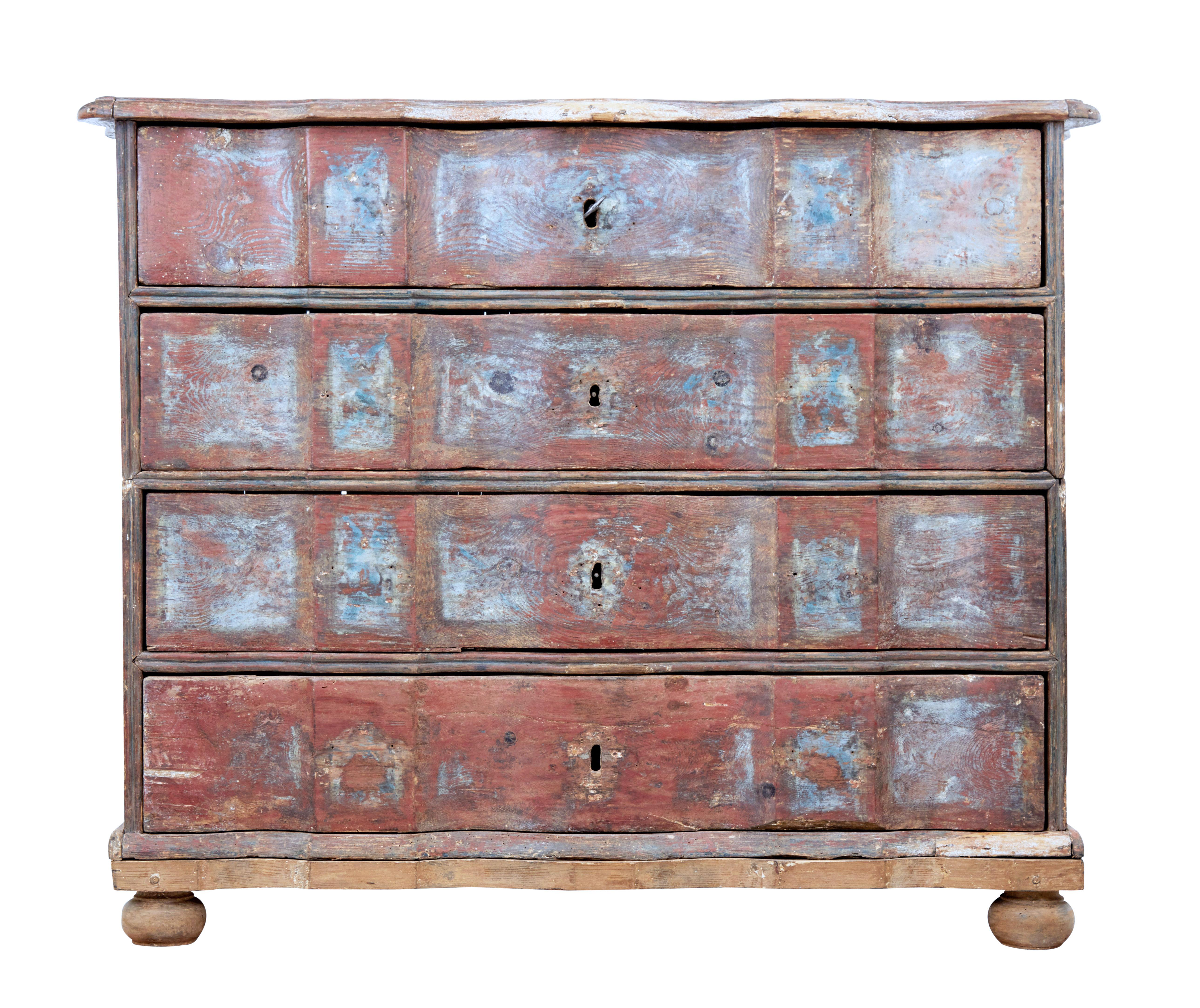 Rare Danish commode with traces of original paint, circa 1750.

2 part chest, made this way because of its generous proportions. Separate later base and feet.

Beautiful scalloped shaped top and drawer fronts. 4 drawers which open on the key.