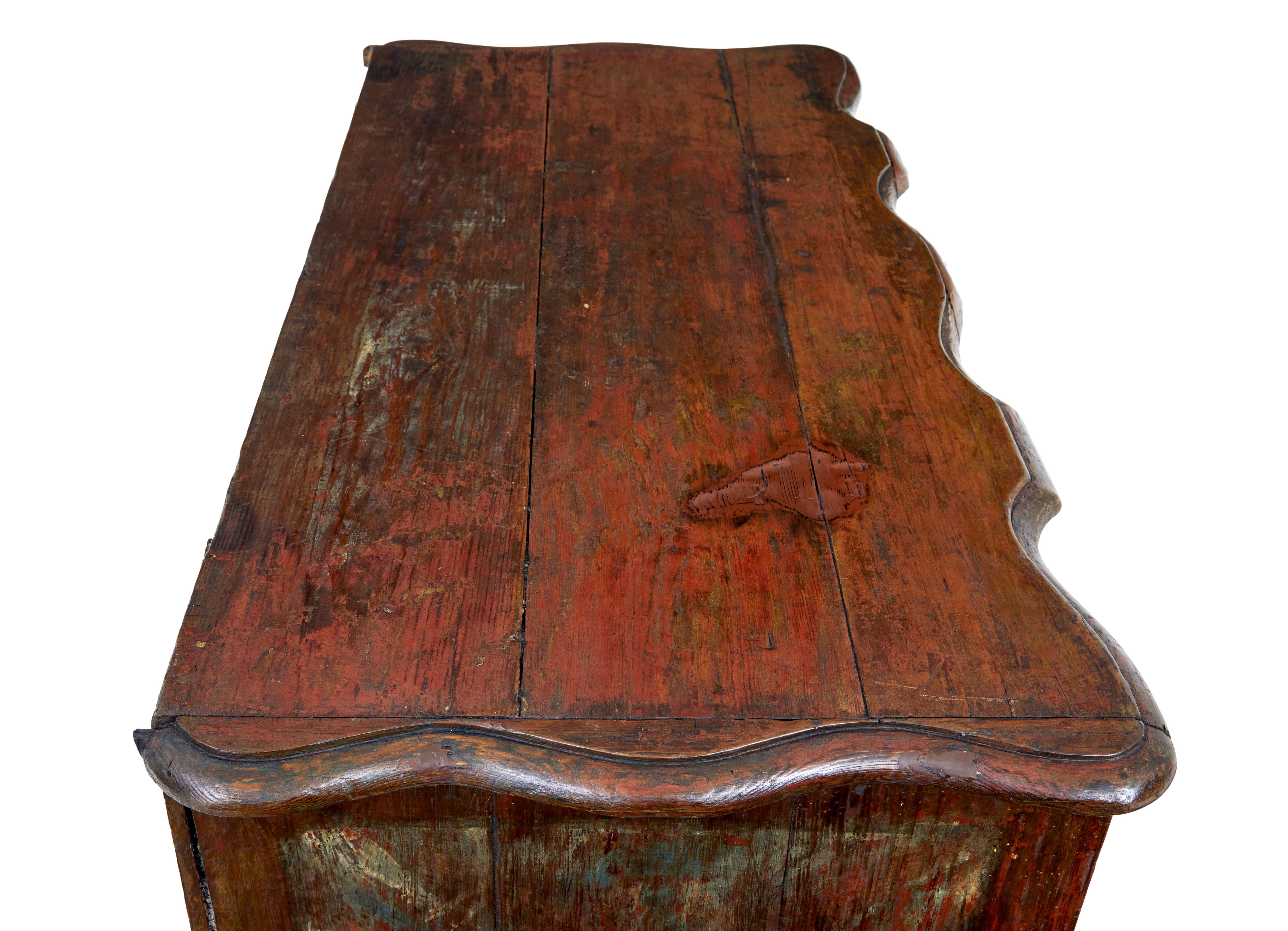 Rare danish commode with traces of original paint circa 1750.

2 part chest, made this way because of its generous proportions.

Beautiful scalloped shaped top and drawer fronts.  4 drawers which open on the key.  Traces of original paint which
