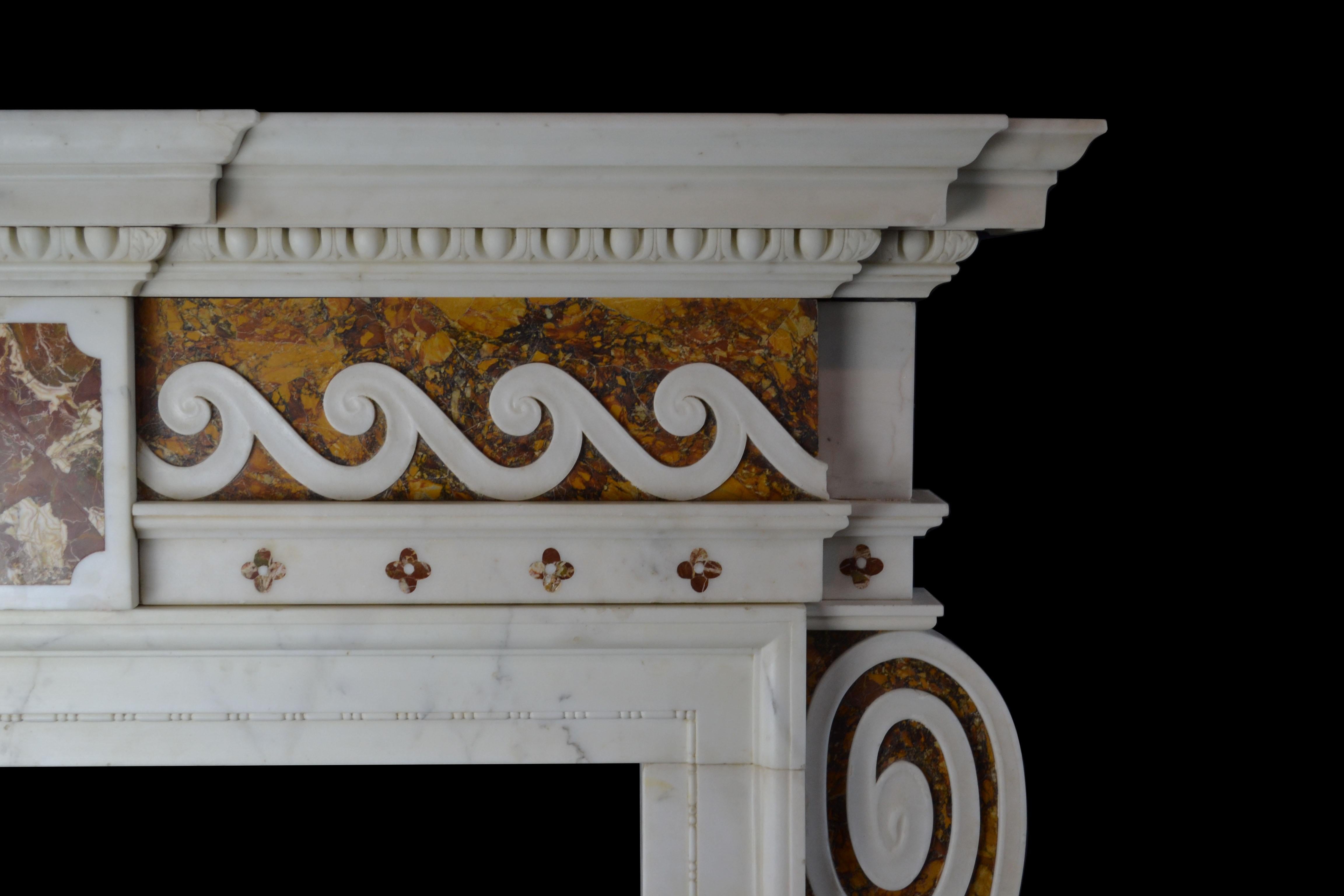 An important mid-18th century English chimneypiece of strong architectural form, with many hallmarks of the work of Sir Henry Cheere. In Statuary, Convent Siena and Sicilian Jasper marbles, with side facing consoles to the jambs, abutting inground