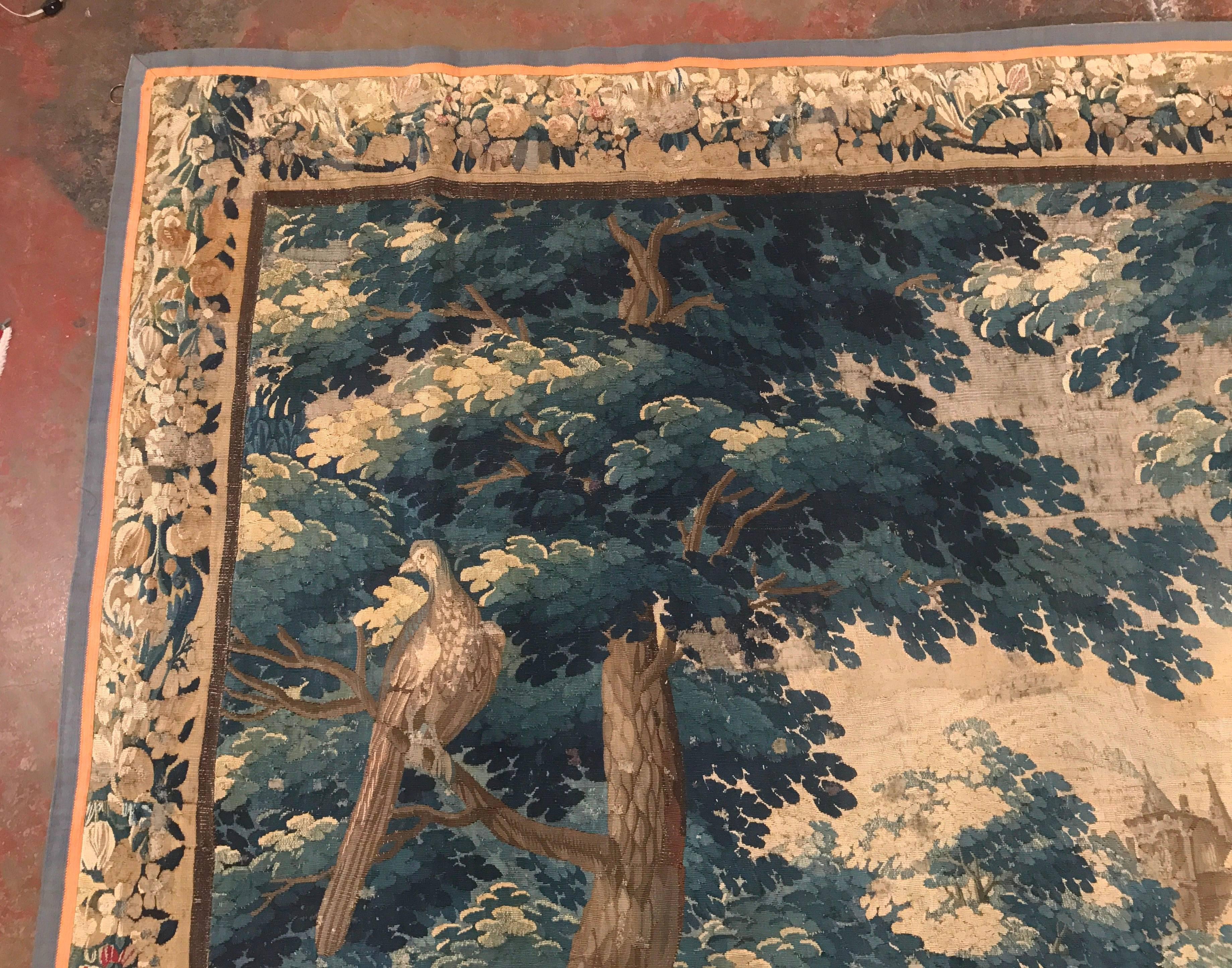 This colorful and square handmade tapestry was woven in Aubusson, France, circa 1760. The antique wall hanging piece has the original border, and depicts a traditional 
