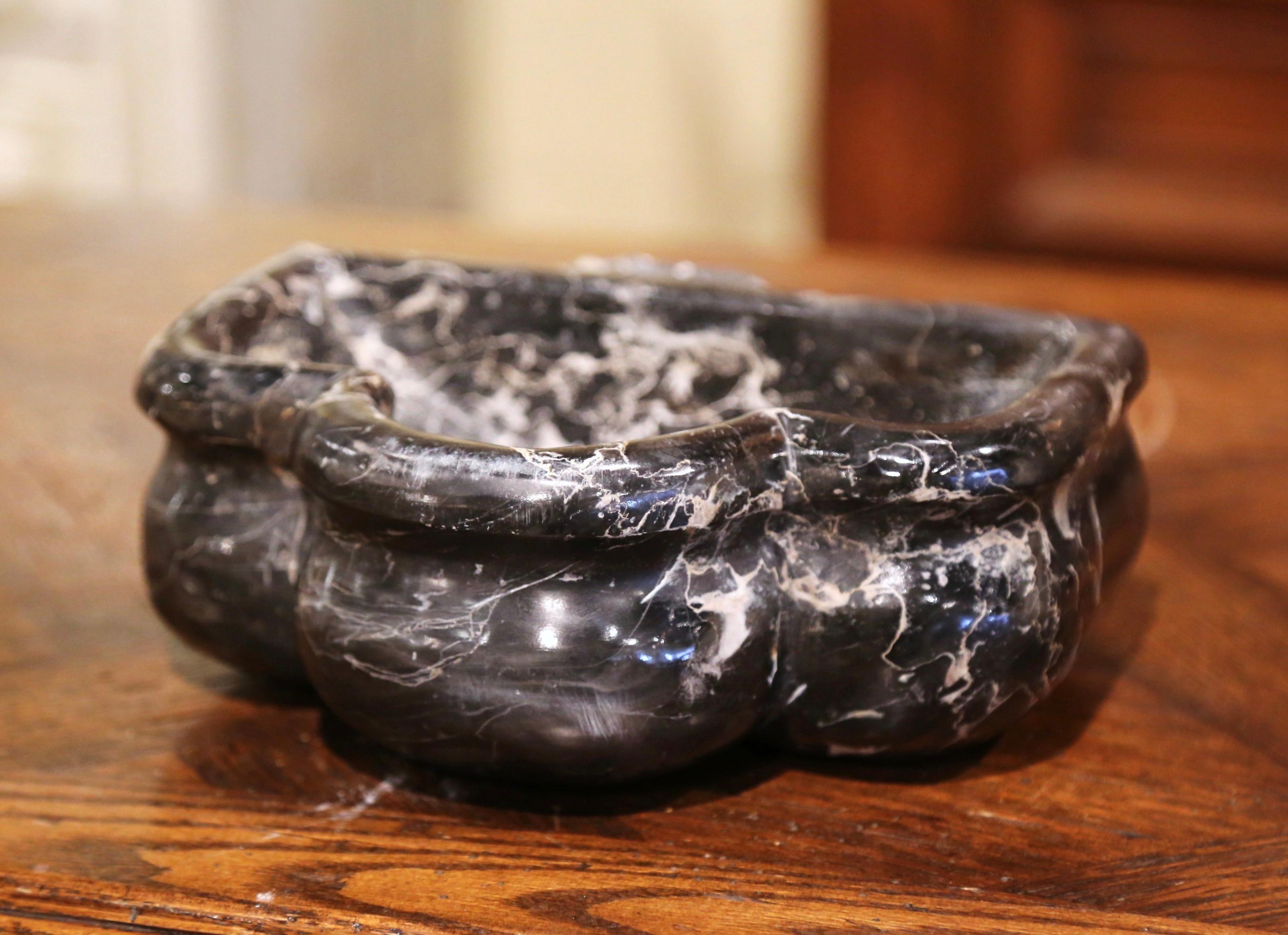 This antique dish shaped as a shell was carved in France circa 1760. Originally at the entrance door of a private chapel, this stoup was inserted in the wall and used to hold the Holy Water. The black and grey marble church recipient is in excellent