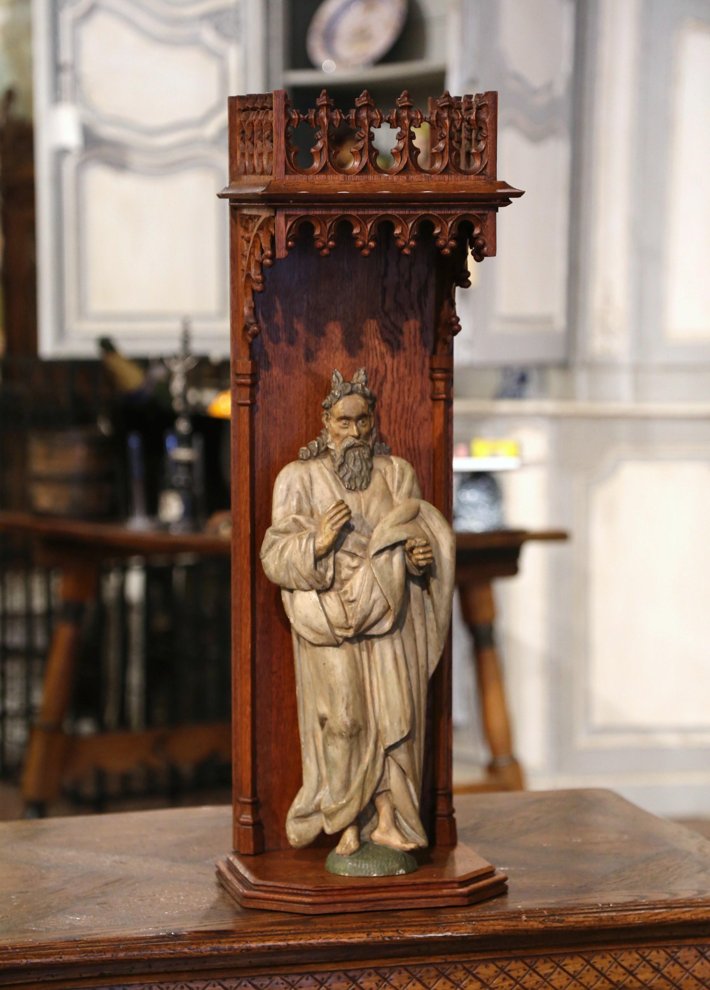 Crafted in France circa 1760 and resting in a carved oak niche, the figure depicts the prophet Moses, the most important prophet in Judaism and Christianity. Moses is best known from the story in the biblical Book of Exodus and Quran as the lawgiver