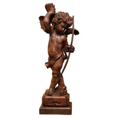 Mid-18th Century French Hand Carved Walnut Cherub Sculpture with Bow and Arrows