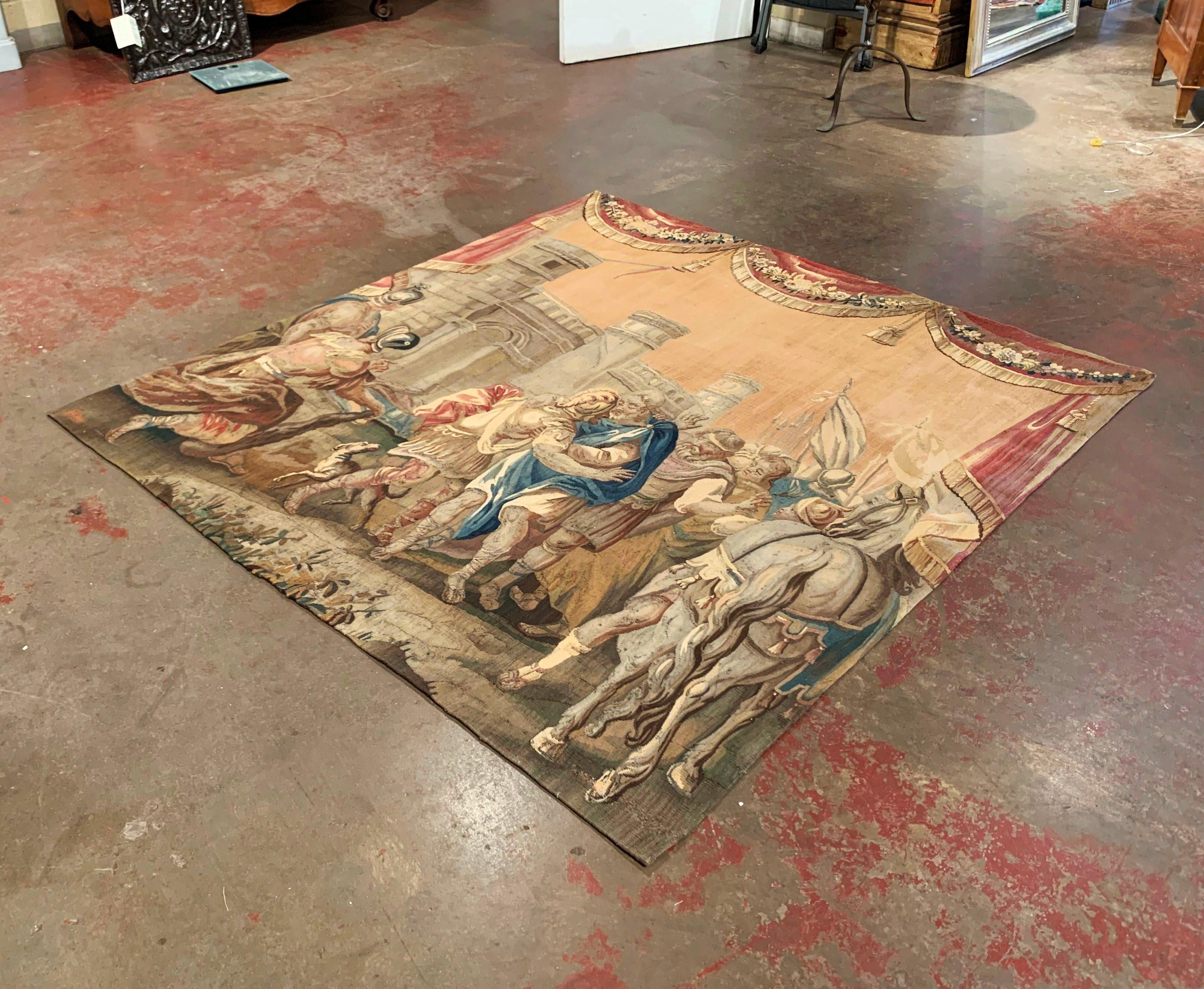 Decorate a wall or a staircase with this antique tapestry fragment with Classical Roman scene. Handwoven in the Royal Manufacture of Aubusson, France, circa 1740, the colorful wall piece features a mythological scene embellished with drapery decor.