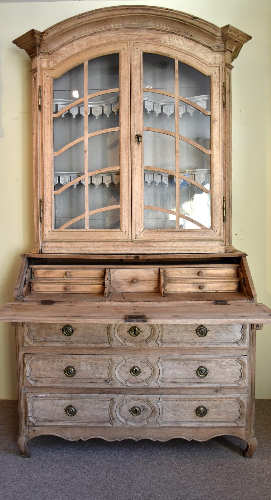 A mid-18th century, French stripped oak bureau bookcase with three drawers to the base on cabriole legs. The piece with domed top and elegant glazing bars

Dimensions
Height 89