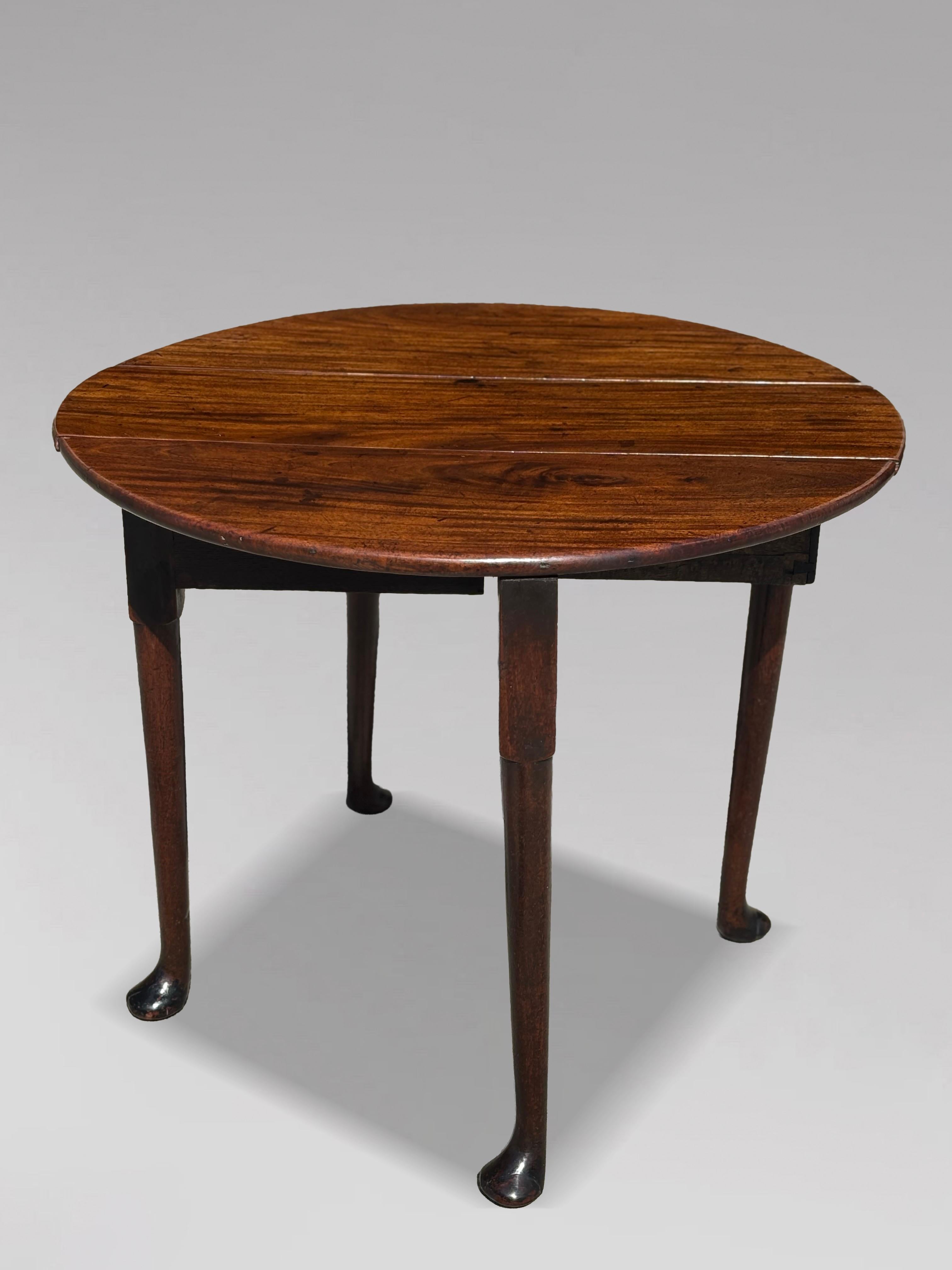 A Fine 18th Century George II Period Mahogany Drop Leaf Table

This is a superb Georgian mahogany drop-leaf oval dining table, dating to around 1760, and crafted from beautifully figured Cuban mahogany. The solid, elegant top displays a wonderful