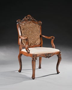 Mid 18th Century Italian Rococo Armchair in Walnut With Extravagantly Carved