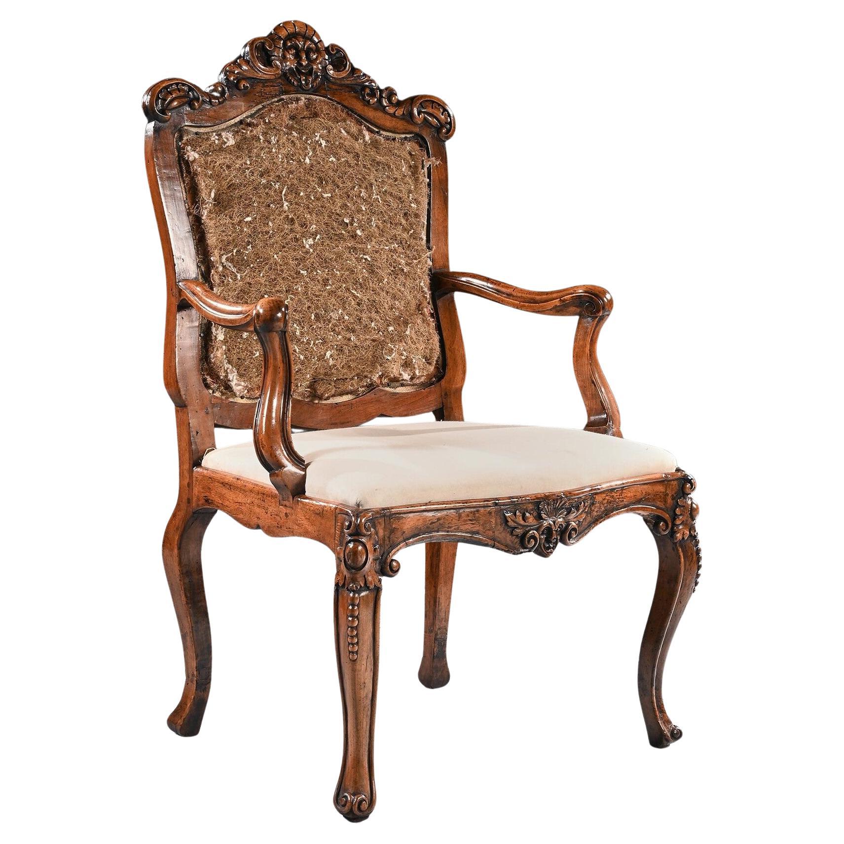 Mid 18th Century Italian Rococo Armchair in Walnut With Extravagantly Carved For Sale