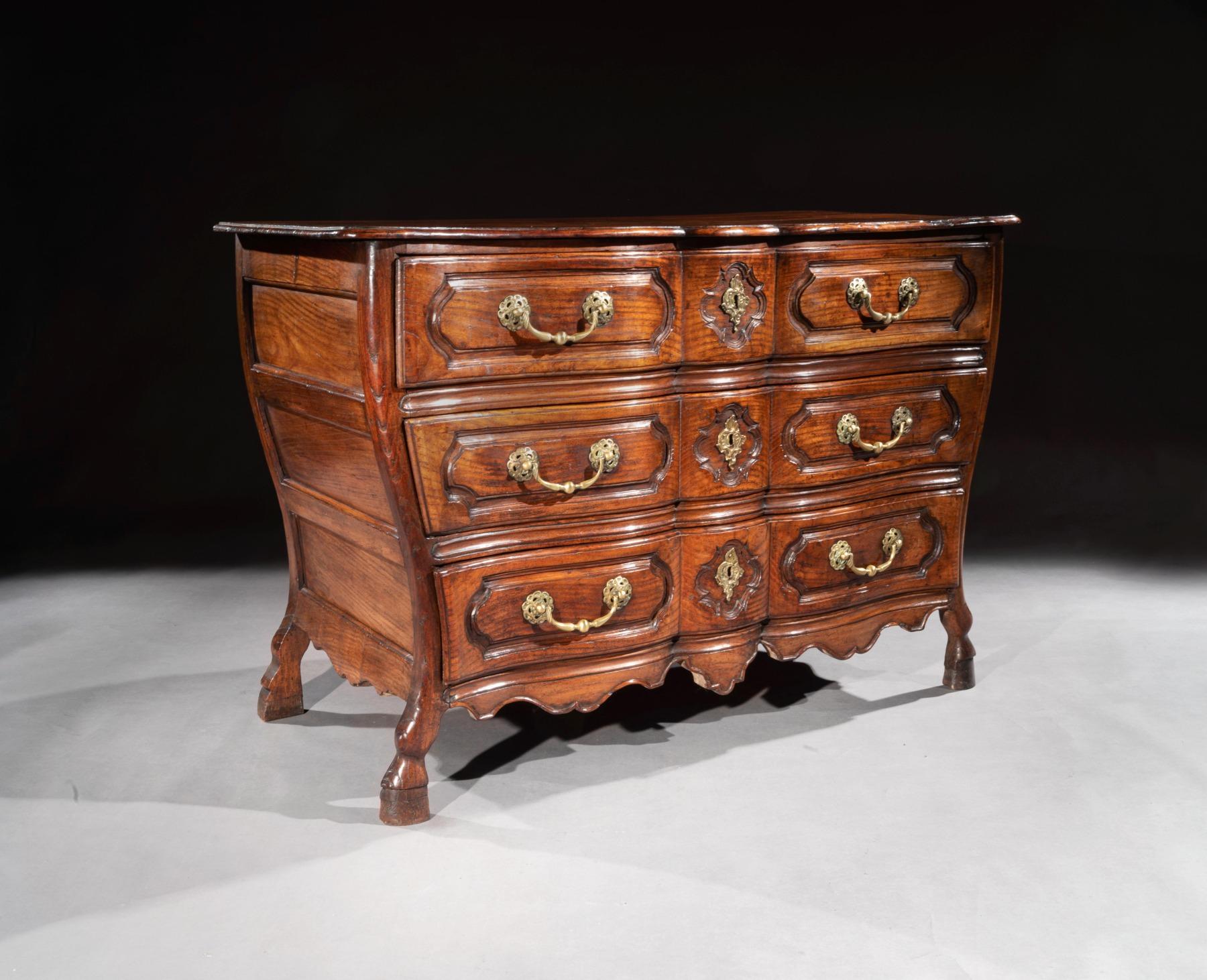 A rare 18th century Louis XV period bombe shaped chestnut provincial commode.

French circa 1750

Of an unusual curvaceous waisted form having a shaped front (often referred to as arc-en-arbalète, meaning in English shape of the crossbow) of