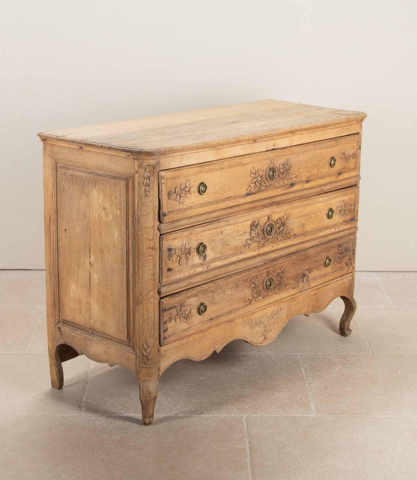 Large mid-18th Century Louis XV/XVI transitional period oak commode. 
Bleached oak with fine hand carved details and brass ring handles. Circa 1760.