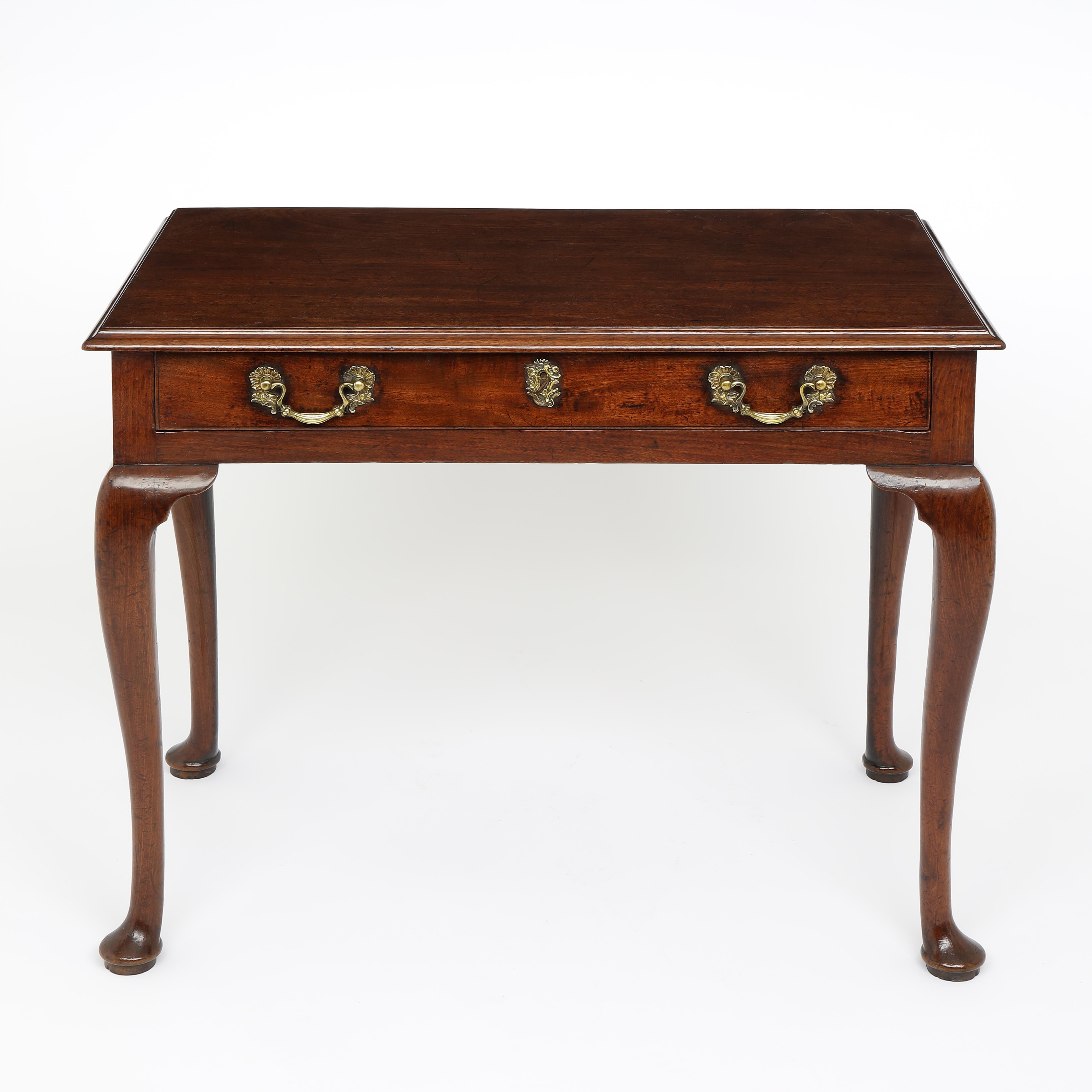 A fine quality George II period Cuban mahogany side table with single drawer below the moulded edge and standing of four well-drawn cabriole legs with pad feet.
In original condition with orginal handles, escutcheon amd and lock.