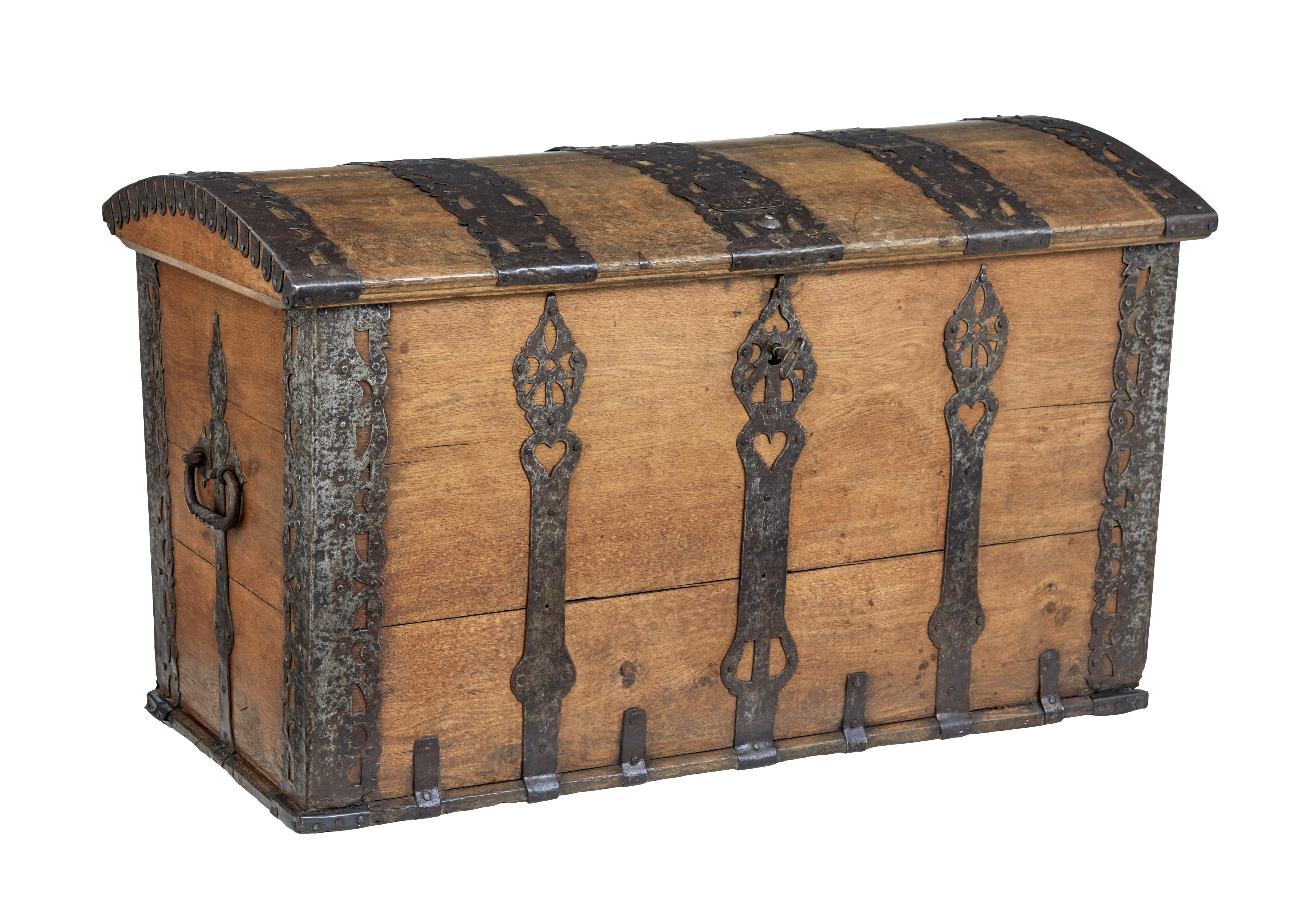 Mid 18th Century oak and iron dome top trunk circa 1769.

Fine quality dome top chest of large proportions. Solid oak, beautifully decorated with cast iron strap work. Lid opens to a plain interior and a fitted candle box.

Original working lock
