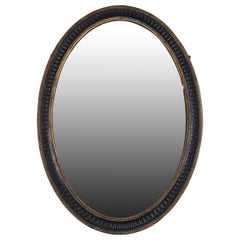 Antique Mid 18th Century Oval Black and Gilt Mirror