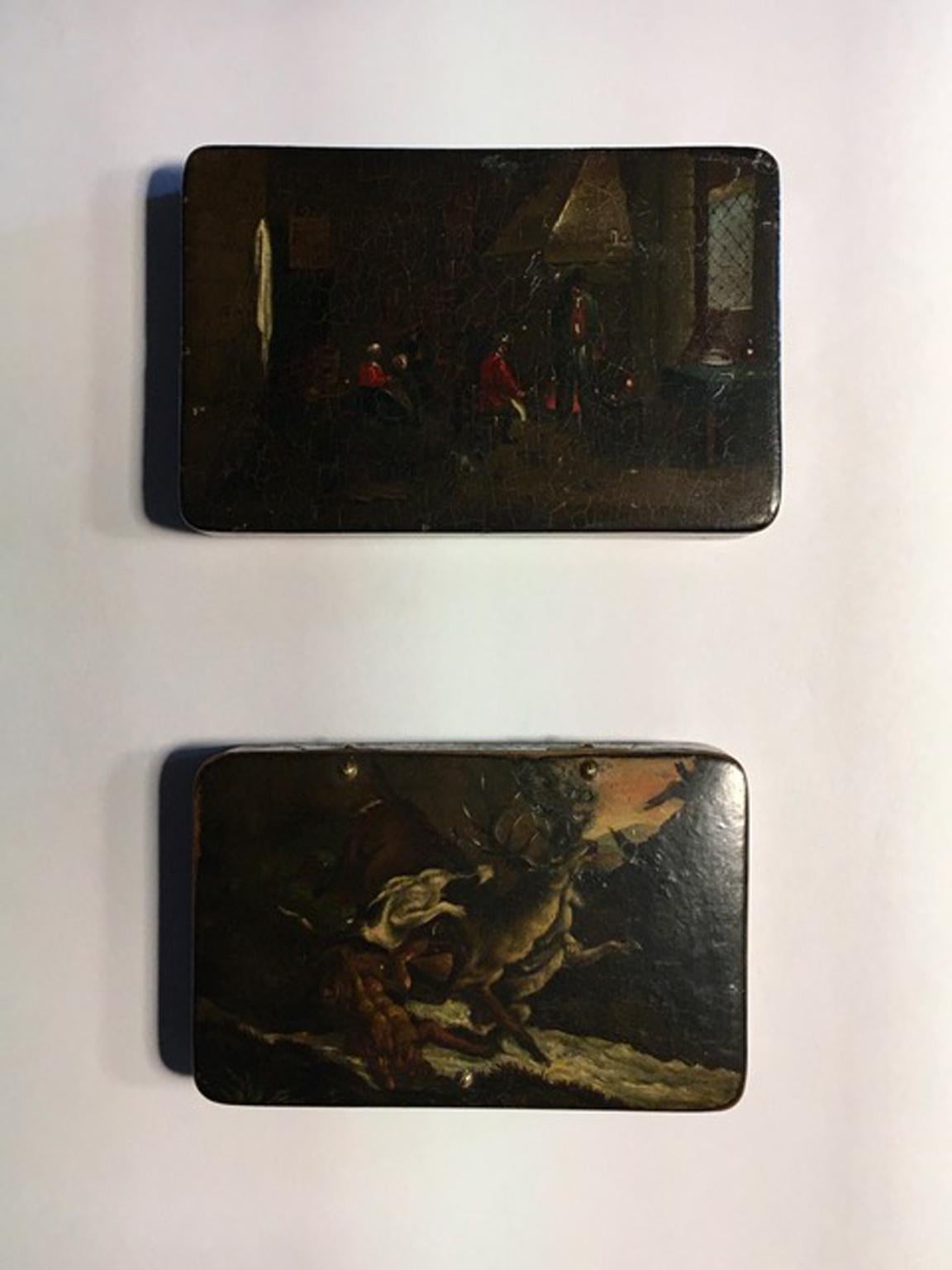These fine wood lacquered wood boxes are in Flemish style; the cover are hand painted with a natural landscape, so fine as Flemish painting can be. The other one has an home interior scene, with the hunters dressed in red.

These pieces could be
