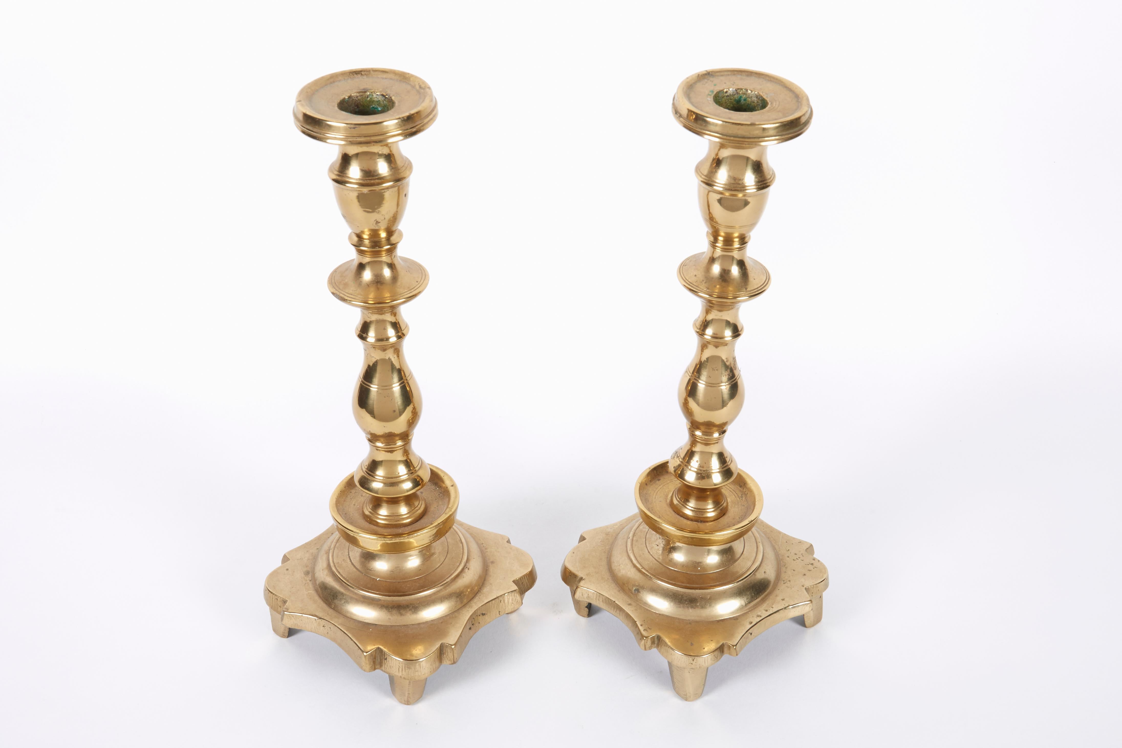 Late 18th century massive brass Sabbath candlesticks.
Footed base with trefoil motif and banding, with bladed knops and ample bobeche.
Hand turned screws for disassembly. For the Jews located in the large swath of territory known as the “Pale of the