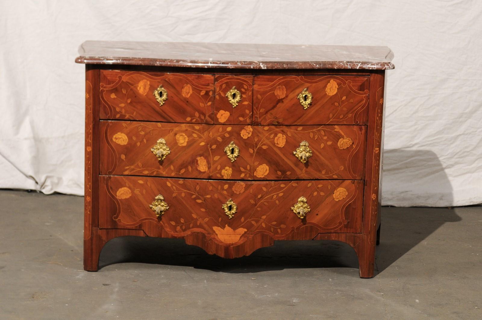 Mid-18th century Regence marquetry marble-top commode.