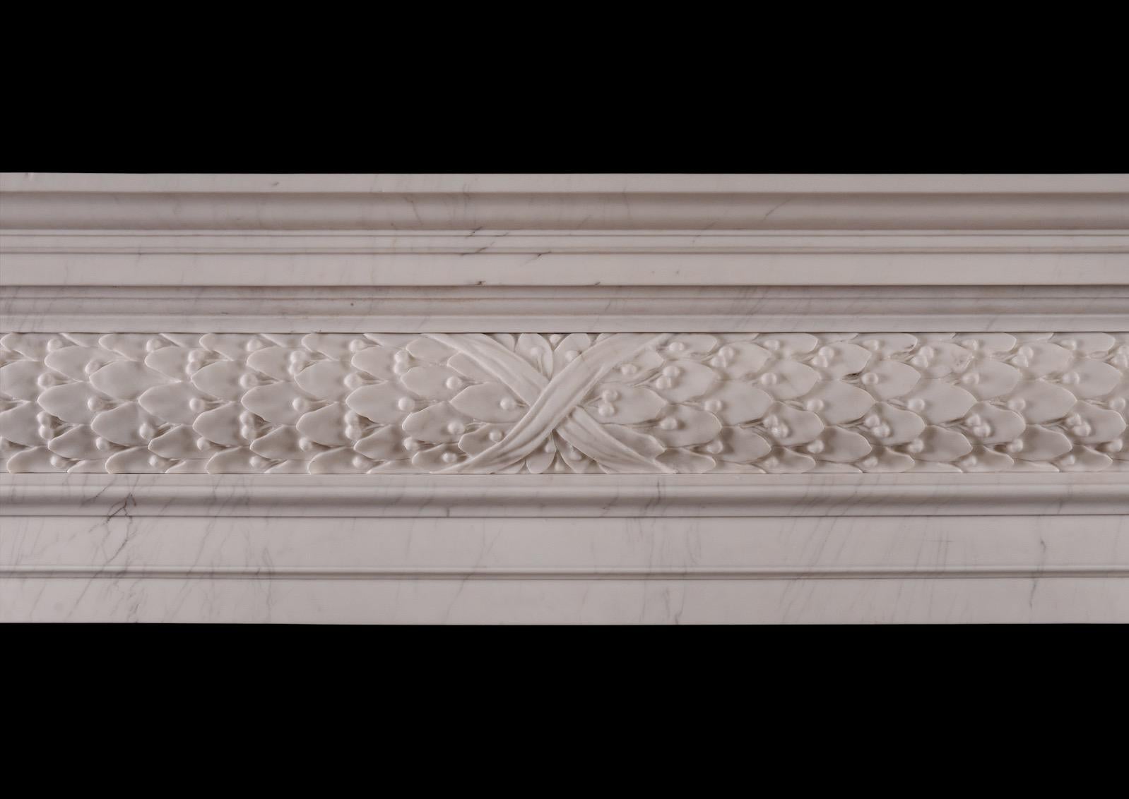 A fine quality copy of a mid-18th century fireplace. The barrel frieze with deeply carved flowing oak leaves. The moulded jambs and lintel with moulded shelf above. White marble in the Georgian style. Modern.

N.B. May be subject to an extended lead