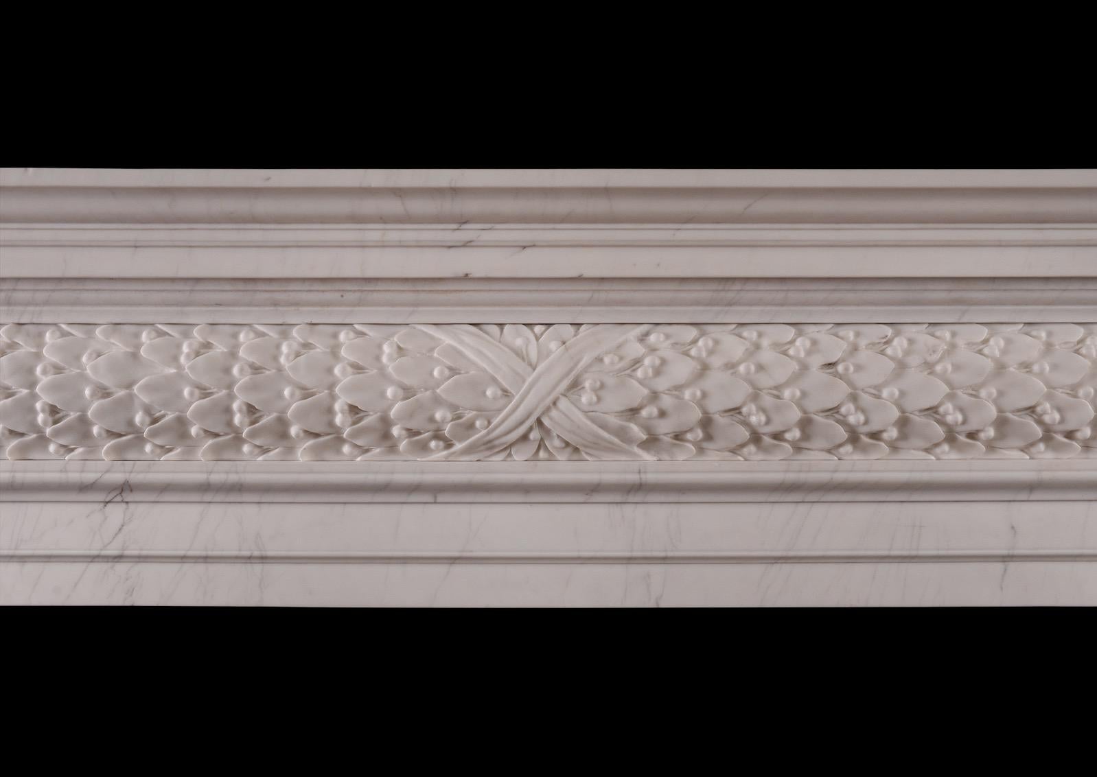 A fine quality copy of a mid 18th century fireplace. The barrel frieze with deeply carved flowing oak leaves. The moulded jambs and lintel with moulded shelf above. White marble in the Georgian style. Modern.N.B. May be subject to an extended lead