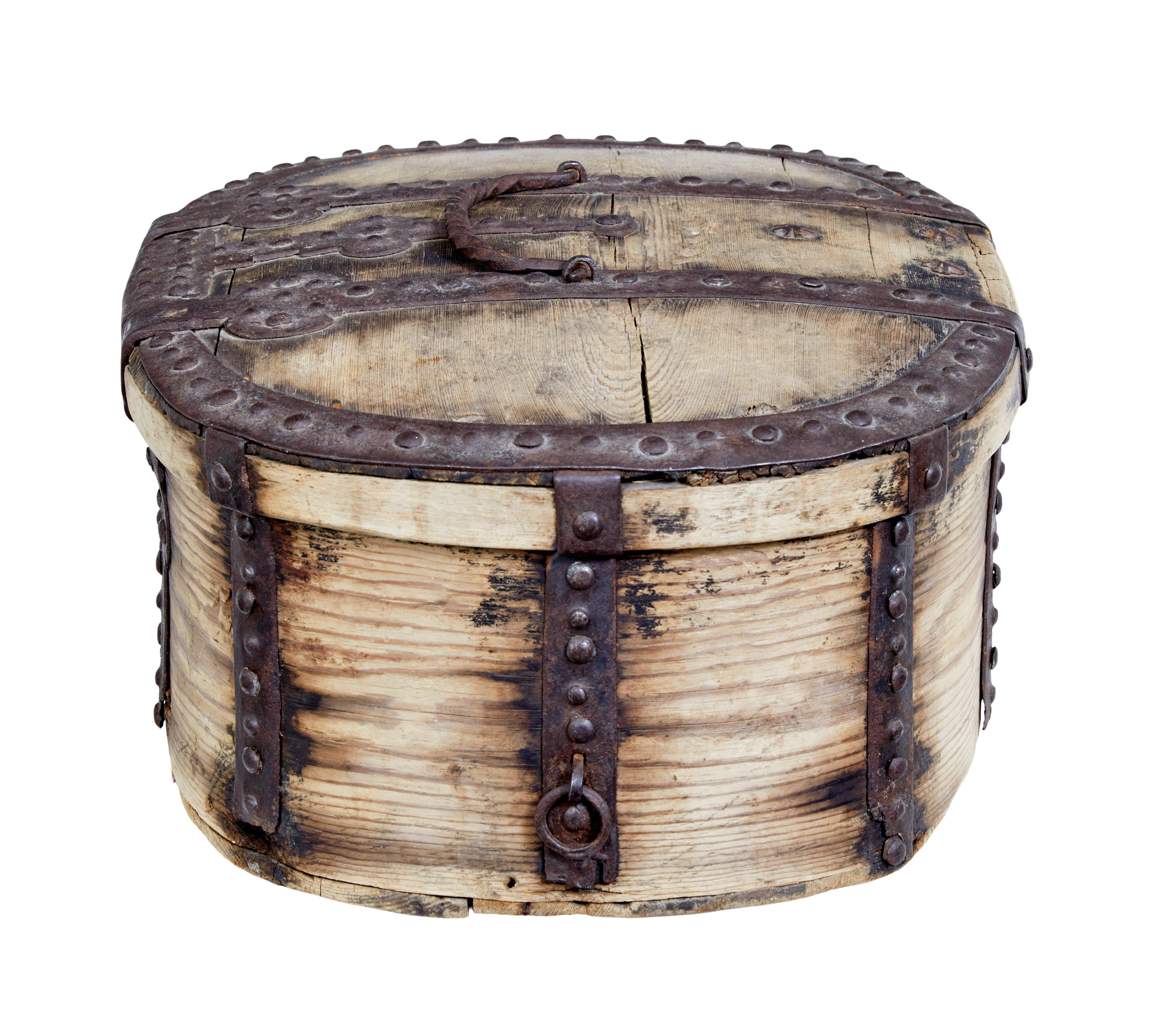 Mid-18th century Swedish pine baroque metal bound box, circa 1740.

Good quality oval baroque period decorative box. Profusely decorated and bound by iron strap work, edging and hinges. All with original studs.

Expected surface marks, age