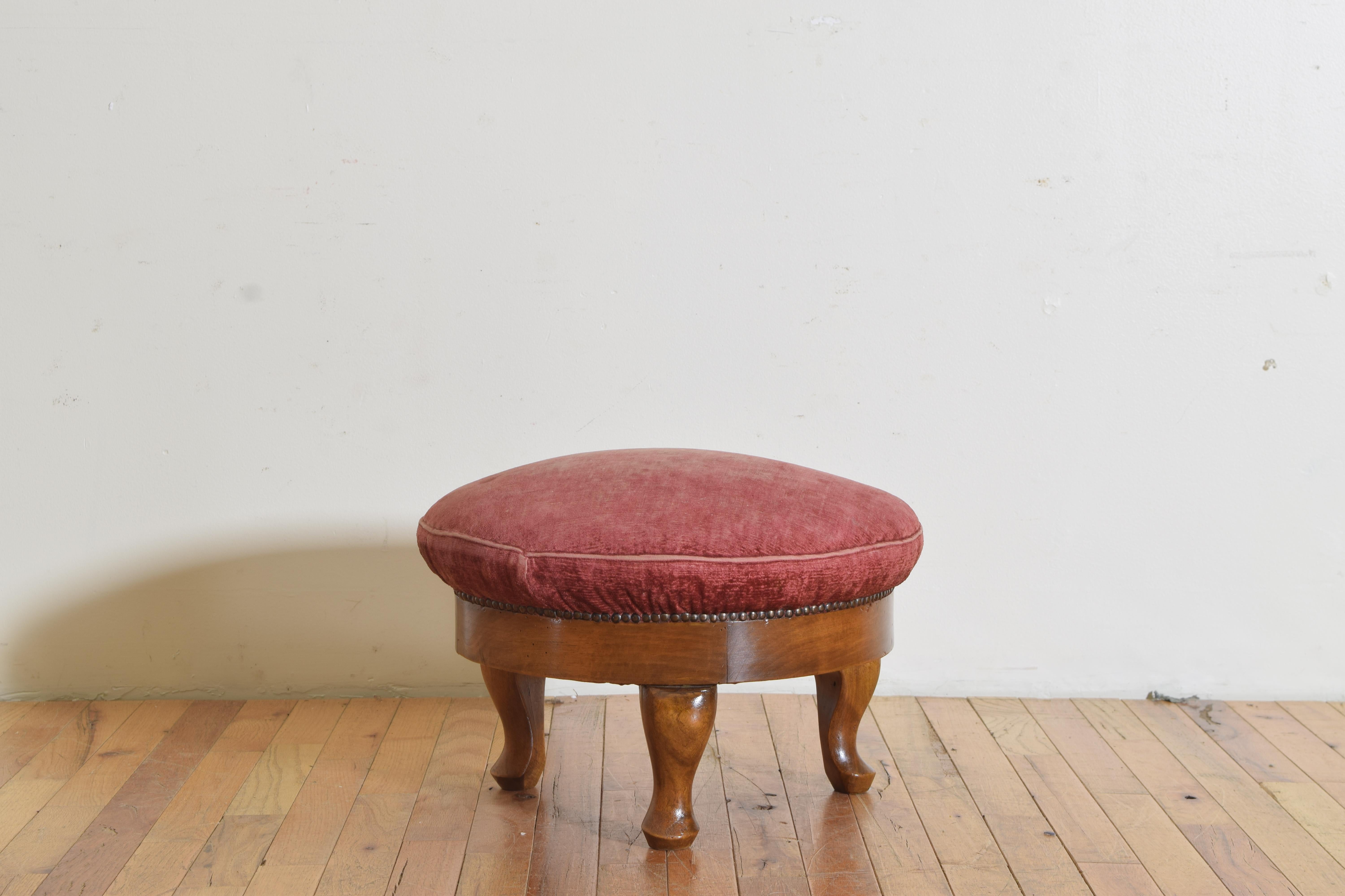 Italian Louis XV period foot stool provincial in style with simply carved three bulbous cabriole legs ending on pad feet. Upholstered with what was once a red now faded velvet.