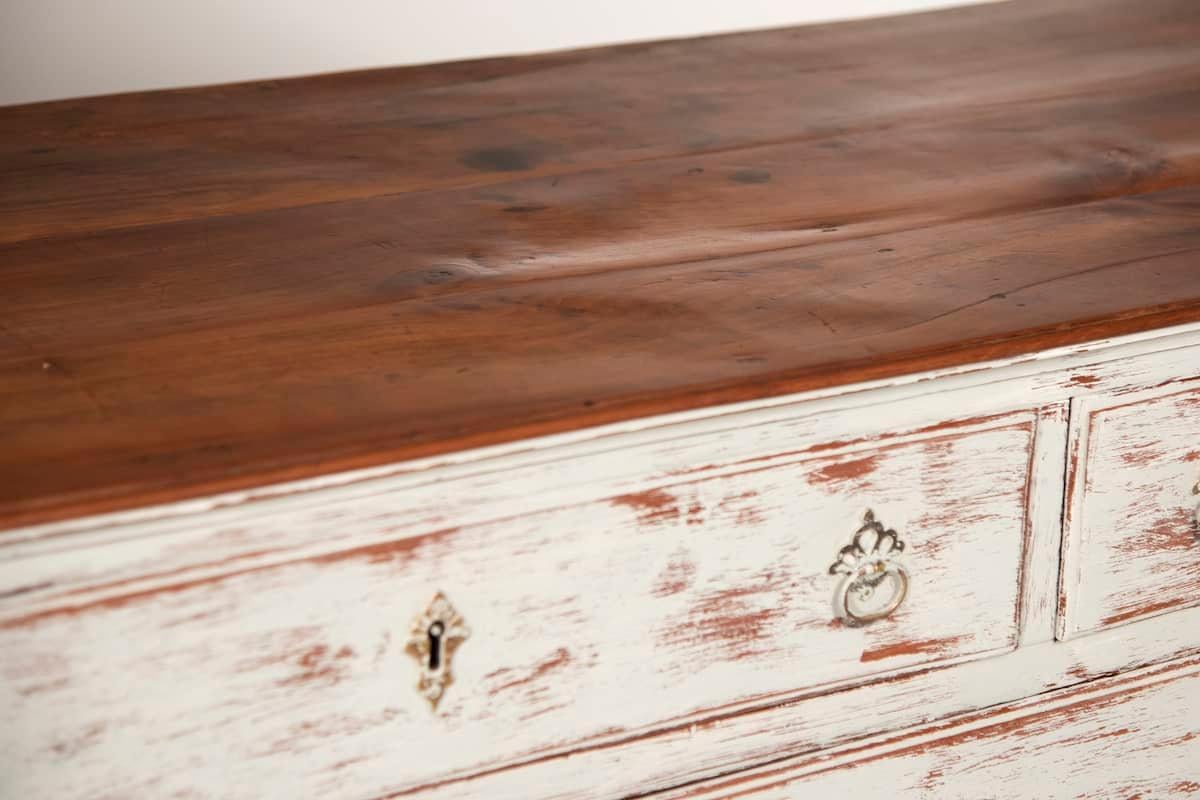 Elegant cherrywood chest of drawers dating back to the mid-1700s, originating from the Veneto region of Italy. The piece is in excellent original condition, including the back panels, drawer bottoms, locks, and handles—all authentic to the period.