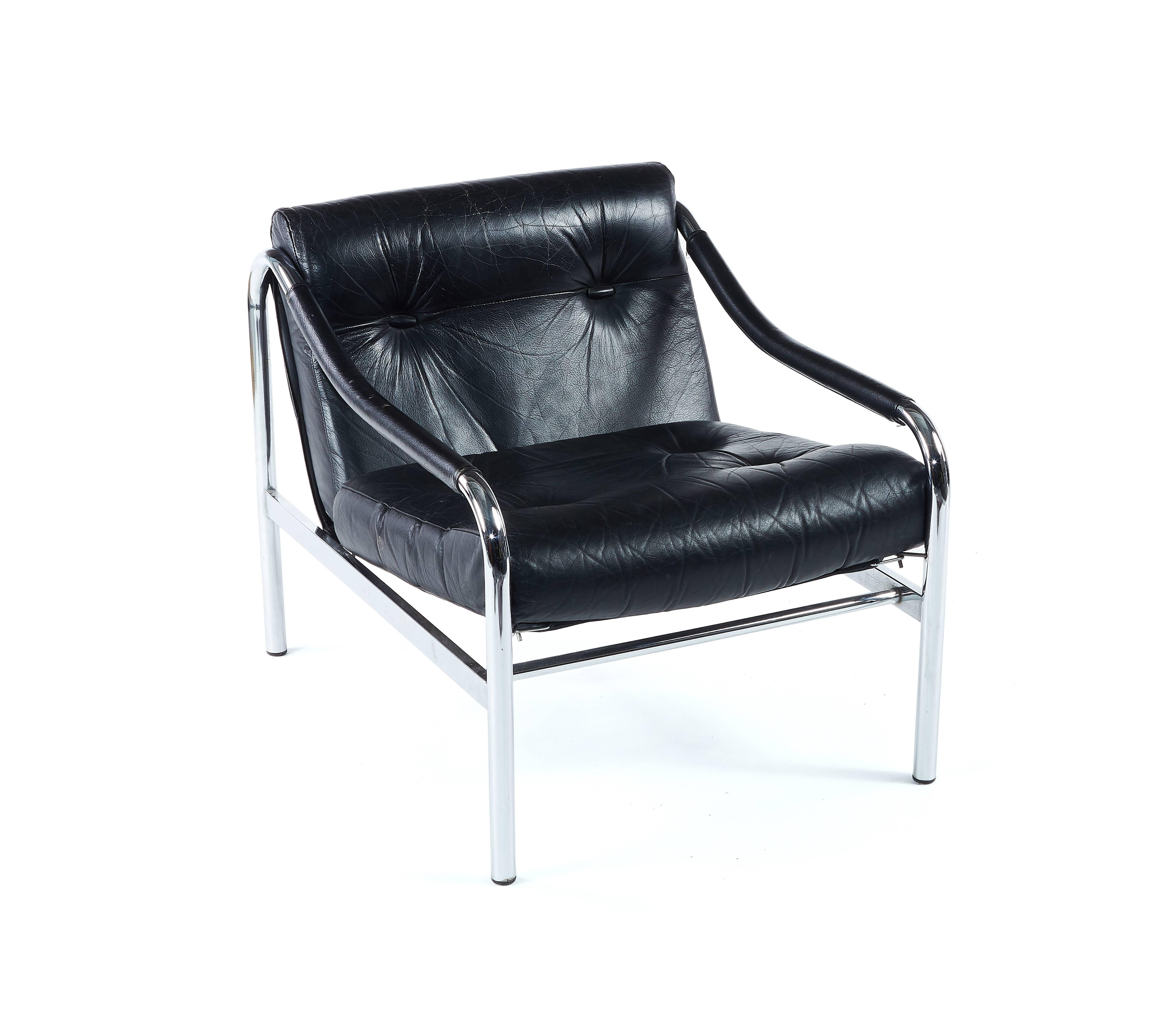 A mid-1970s black leather and chrome suite of Kadia seat furniture by Pieff
Comprising a lounge armchair, a two-seat and a three-seat sofa, the tubular chrome frames with removable buttoned cushions, with Pirelli rubber seat diaphragms, the chair