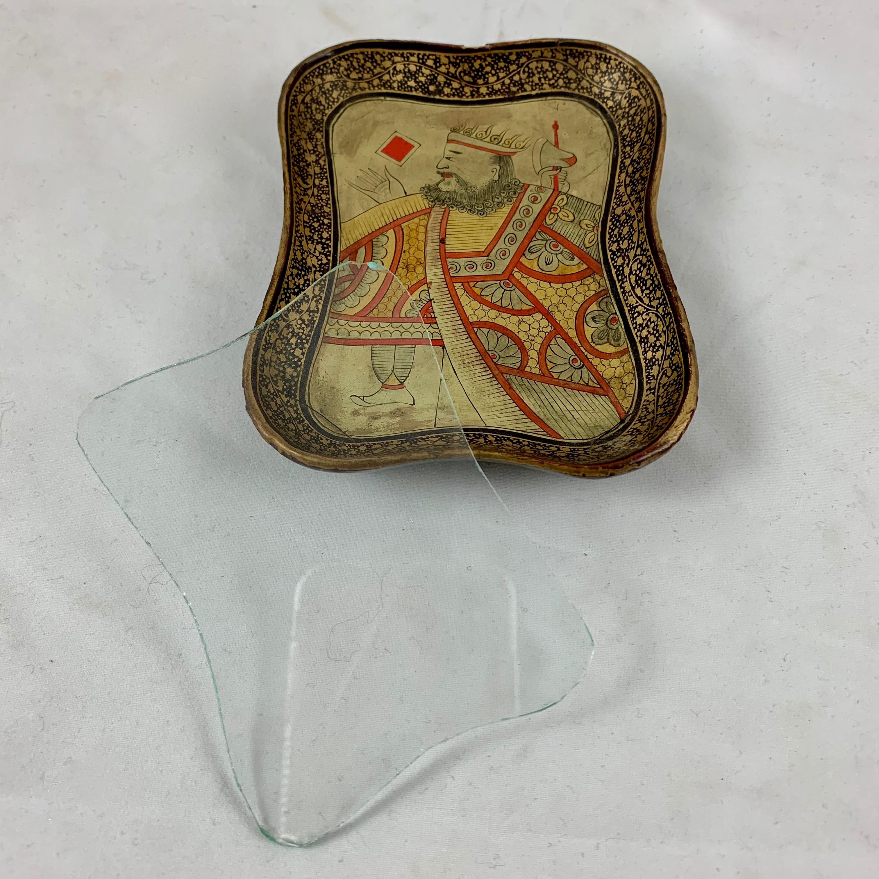 An English lacquer papier mâché card counter tray with the original shaped glass liner, circa 1850-1860.

A vide-poche counter tray, especially made to be used in card games for holding chips or bone counters when gambling. Handmade and no two are