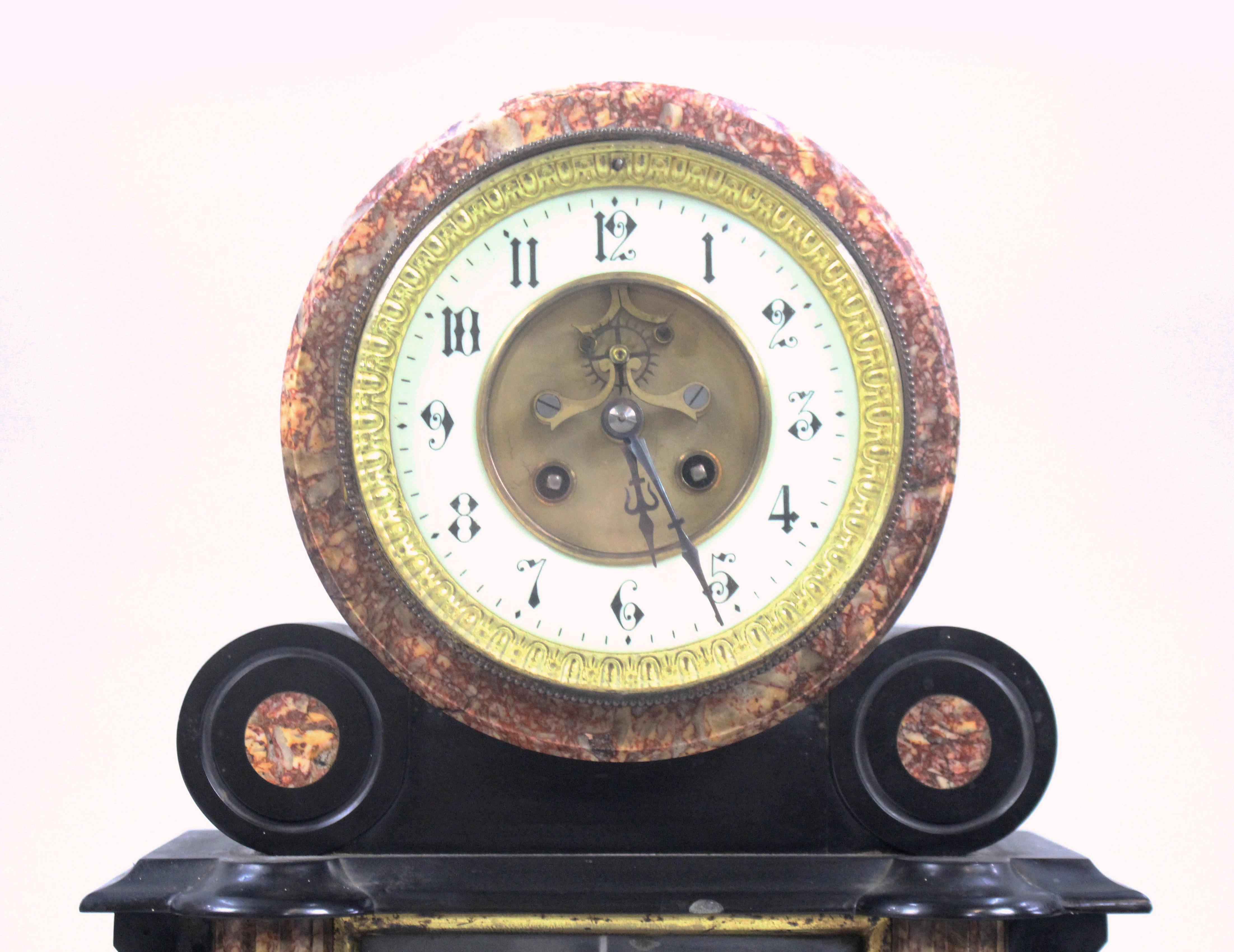 Period
19th century.

Dial
enamel dial with Roman numerals, brass hands, two winding holes, brassouter ring

Decoration 
marble body with bronze putti atop, brass globe and telescope. Heavy ornate ormolu mounts to the body, ormolu