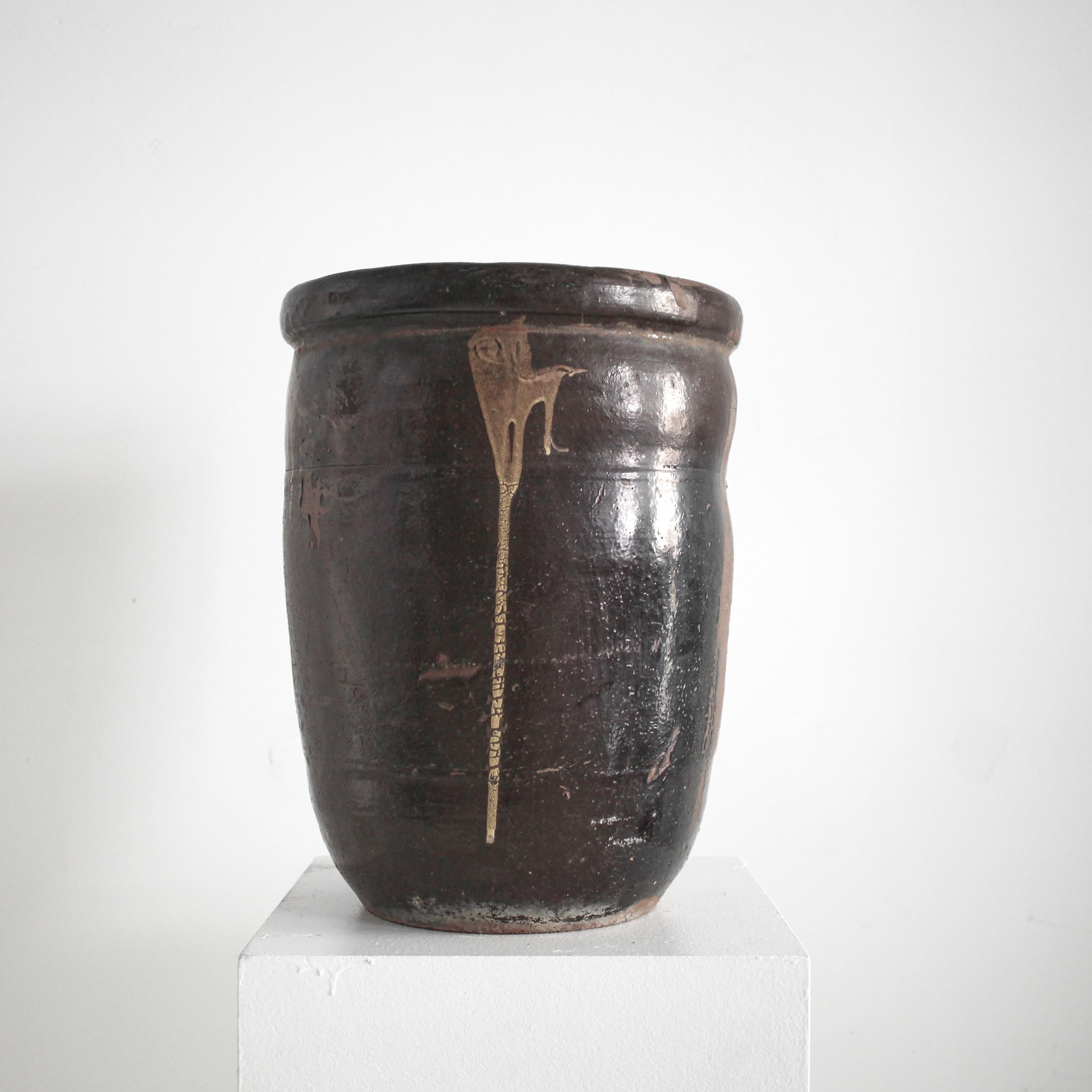 A good sized mid 19th C. Japanese glazed terracotta vessel.Originally used for the storage/transportation of miso.

Due to the vessels utilitarian past it has developed a rich patina over the 100 + years of regular use.