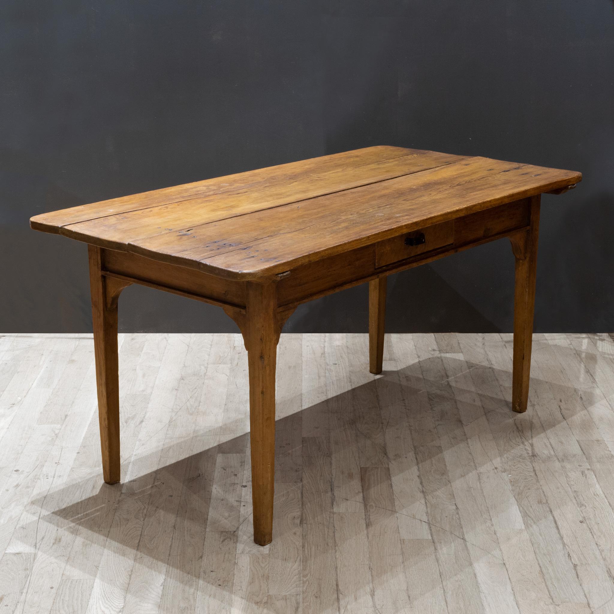 ABOUT

A handmade rustic mid-19th century Mennonite farmhouse table table with center drawer. The top consists of two wide planks which is an indication of age. Harvested trees where much larger during this period. Antique nail heads are clearly
