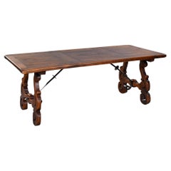 Mid-19th Century Spanish Rustic Dark Oak Dining Table with Iron Stretcher