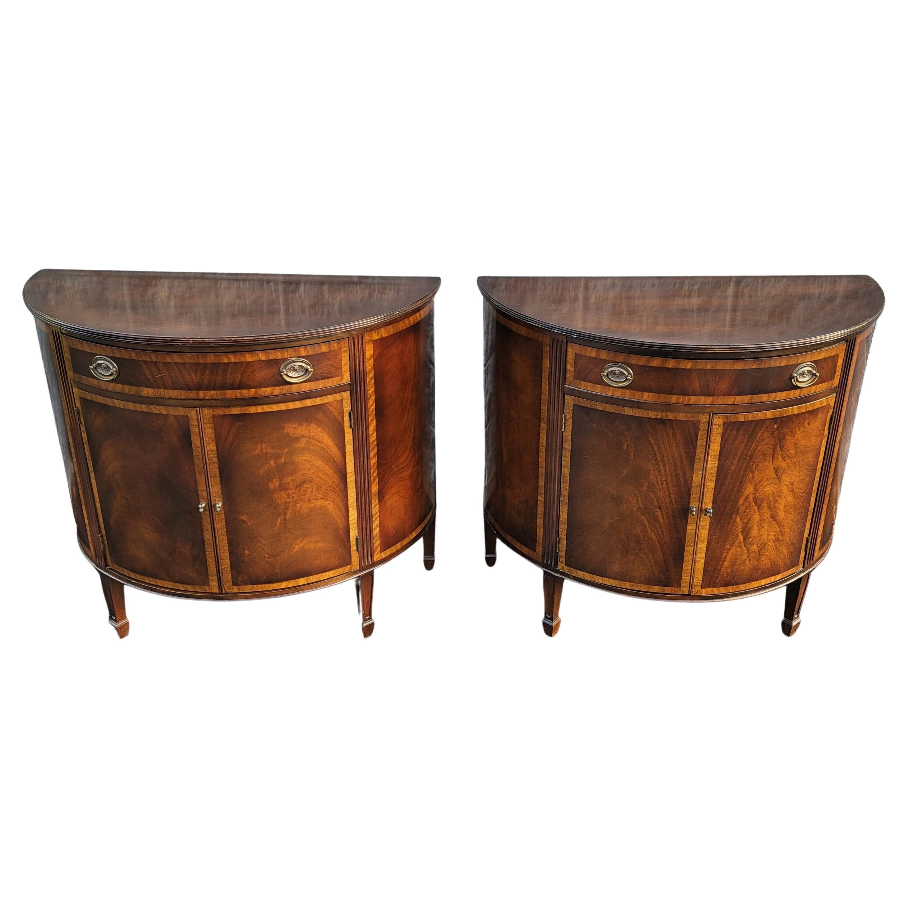Gorgeous mid-19th centruty George III Demilune banded flame mahogany commodes cabinets in good antique condition with a large top drawer, Double front doors that open to reveal a tri level adjustable height shelf. Measures 38