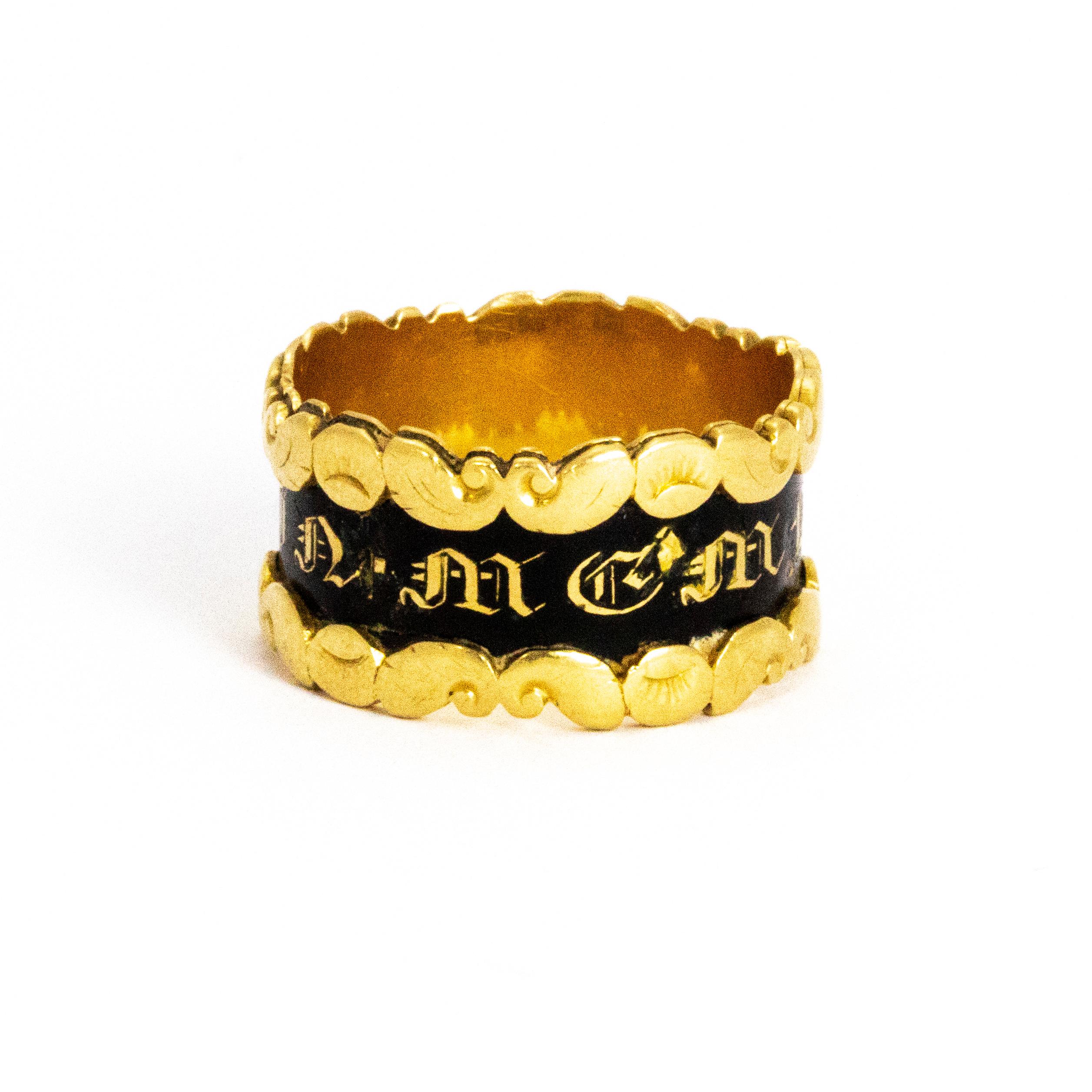 A superb mid-19th century mourning band. 'IN MMEMORY OF' is written in ornate gold lettering on black enamel around the wide band. Modelled in 18 karat yellow gold

Ring Size: O or 7.5
