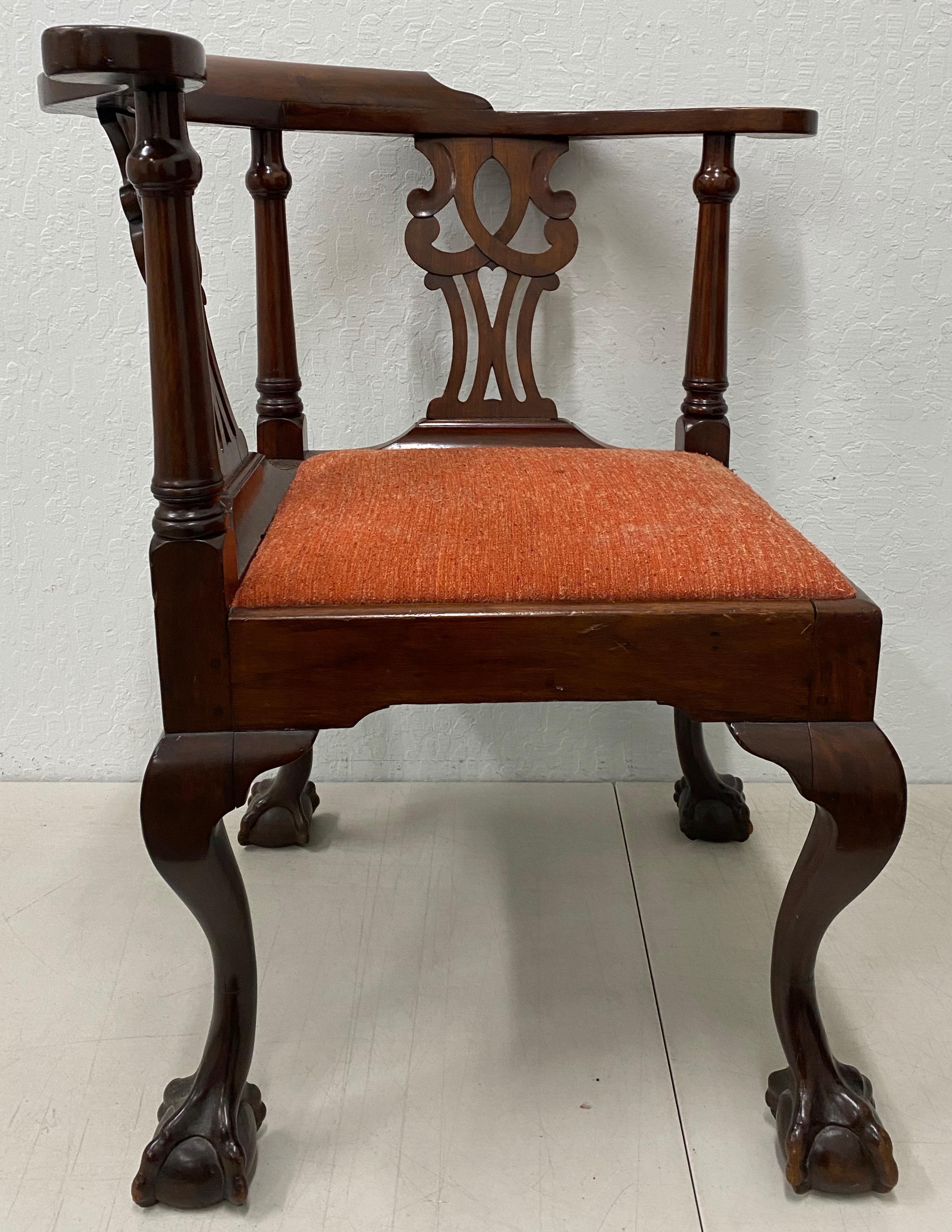 Mid-19th century American Chippendale corner chair, circa 1850s

Hand carved, custom made solid mahogany round-about chair with carved ball and claw feet. The seat lifts up / change fabric with ease. The seat of the chair allows the user to change