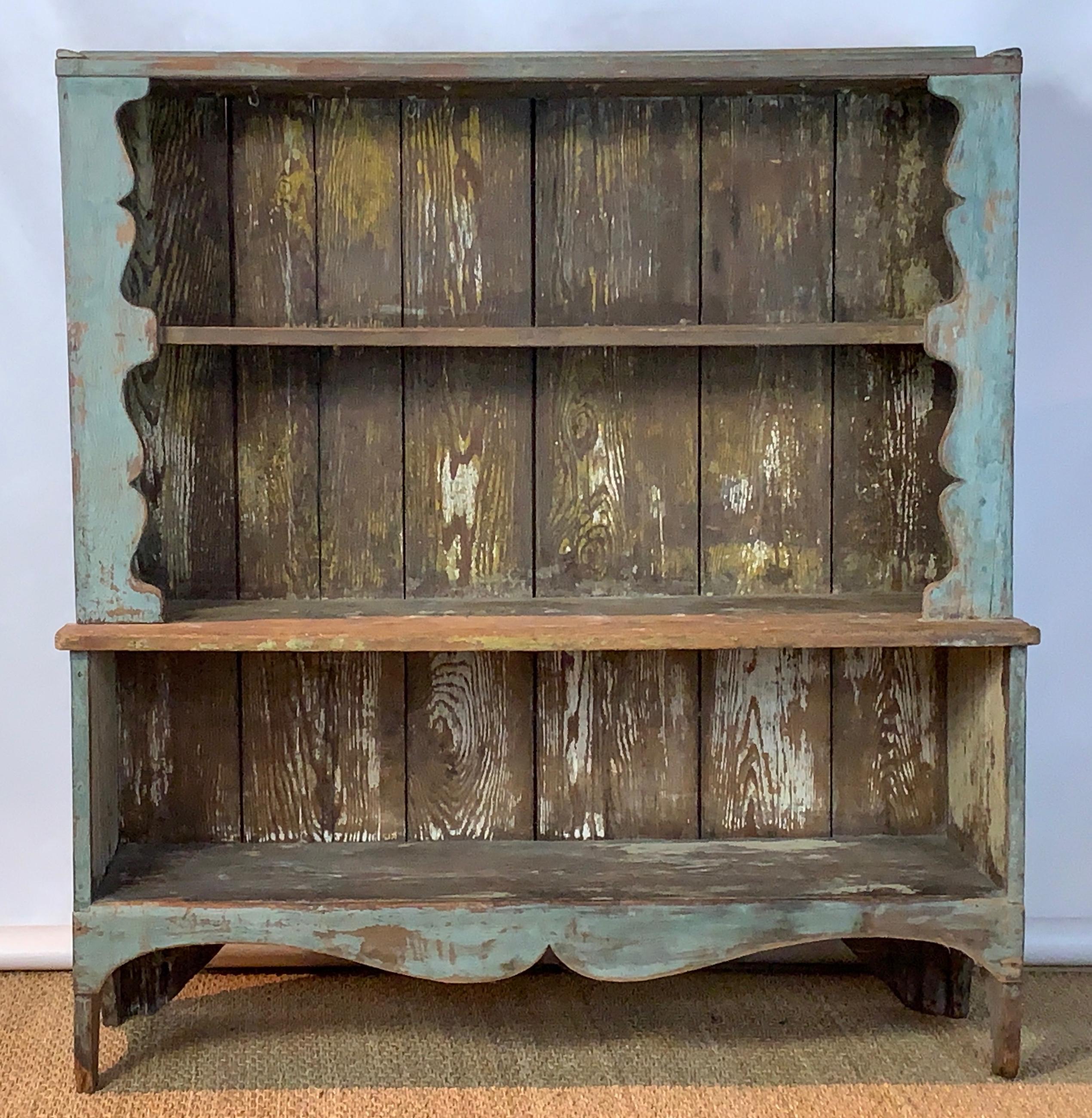 A very charming mid-19th century American painted pine open shelf cupboard with original robin's egg blue paint and wonderful patina overall. The top two shelves are fitted with early brass cup hooks.