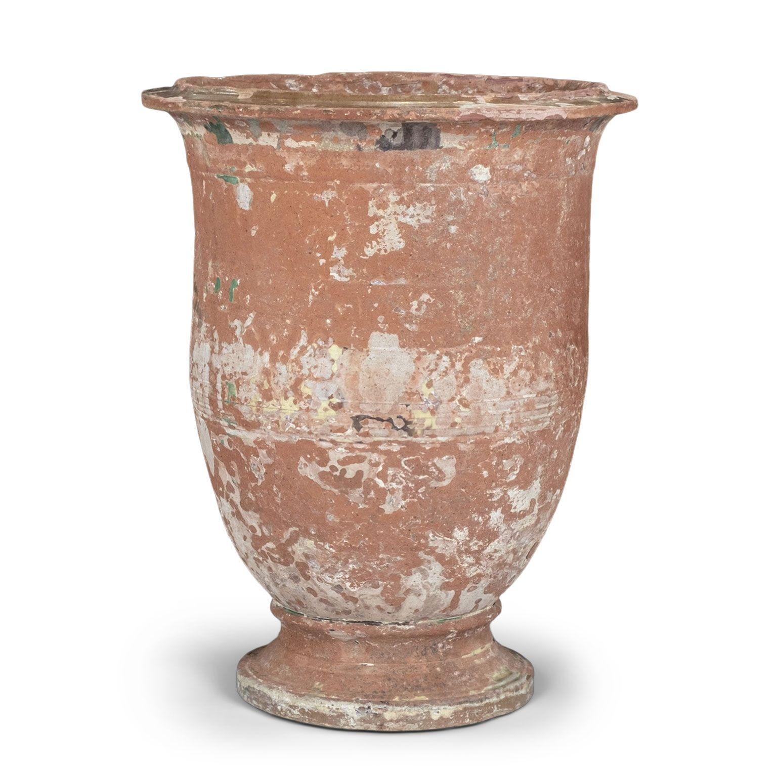 Mid-19th century Anduze Jar retaining remnants of green glaze. A second similar Anduze jar is available that varies slightly in size (see last two images). The two together make an excellent near-pair that are equally suitable indoor or outside, on