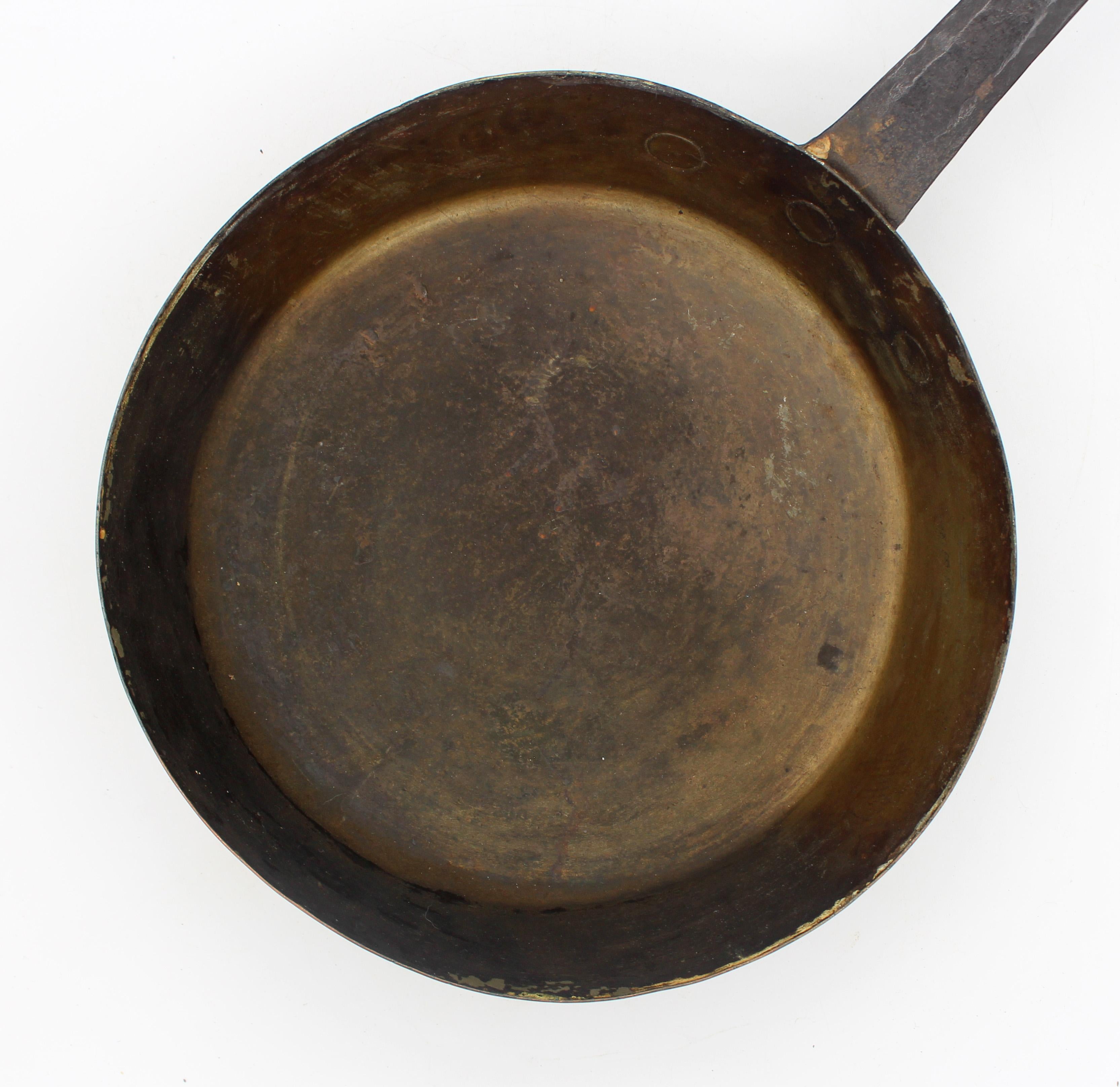 Mid-19th century low copper pan or sauce pan with iron handle, Anglo-French. Good quality, dove-tailed construction. Medium sized pan. T-strap shape handle attachment with rivets. Condition commensurate with age & use. 20