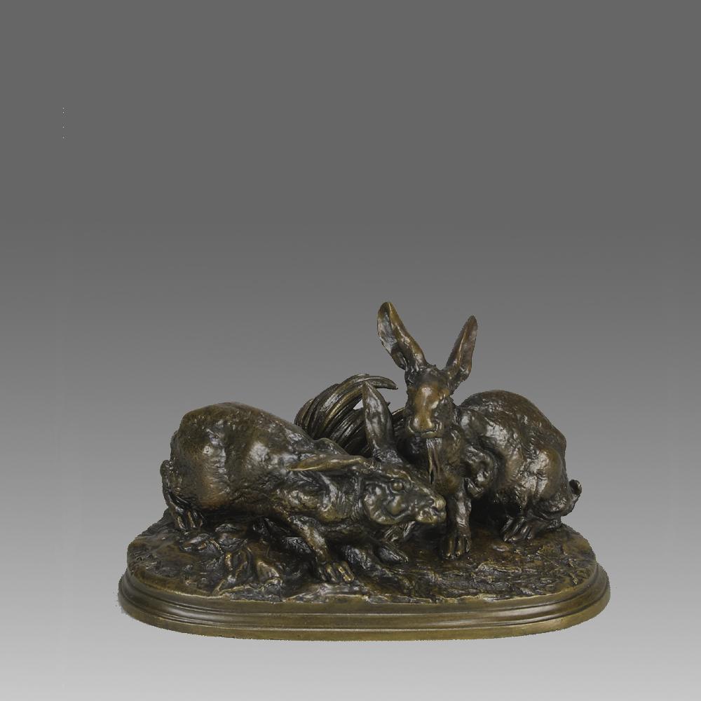 A delightful mid 19th Century Animalier bronze study of two rabbits on an oval base. The bronze exhibiting excellent hand chased surface detail and good rich colour, raised on naturalistic oval stepped base and signed P J Mêne.

ADDITIONAL