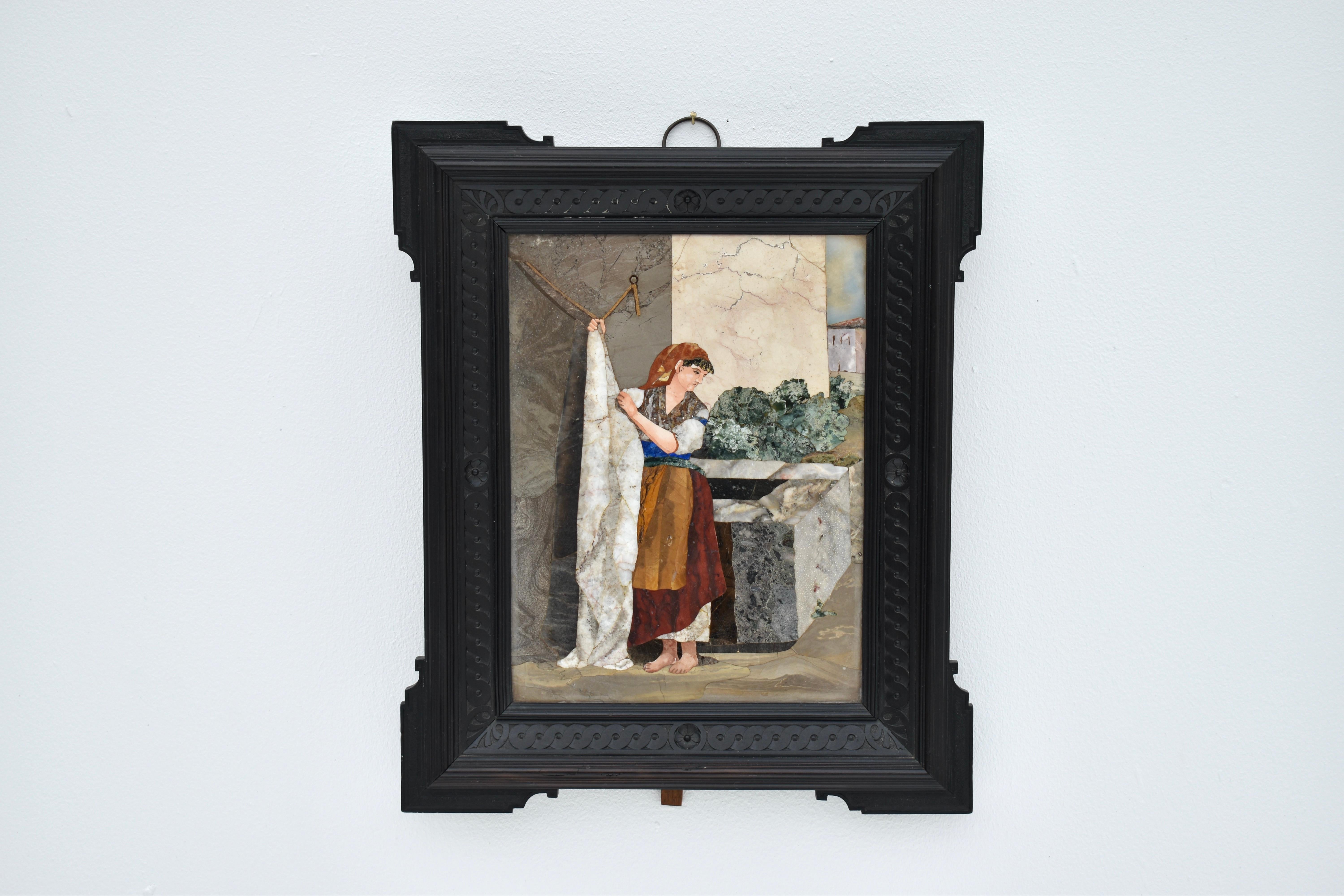 A very fine Mid 19th Century Pietra Dura inlaid panel depicting an Italian street scene. A very pleasing composition crafted from cut marble and other selected semi precious stones such as Lapis Lazuli.

Complete with the original ebonized hand