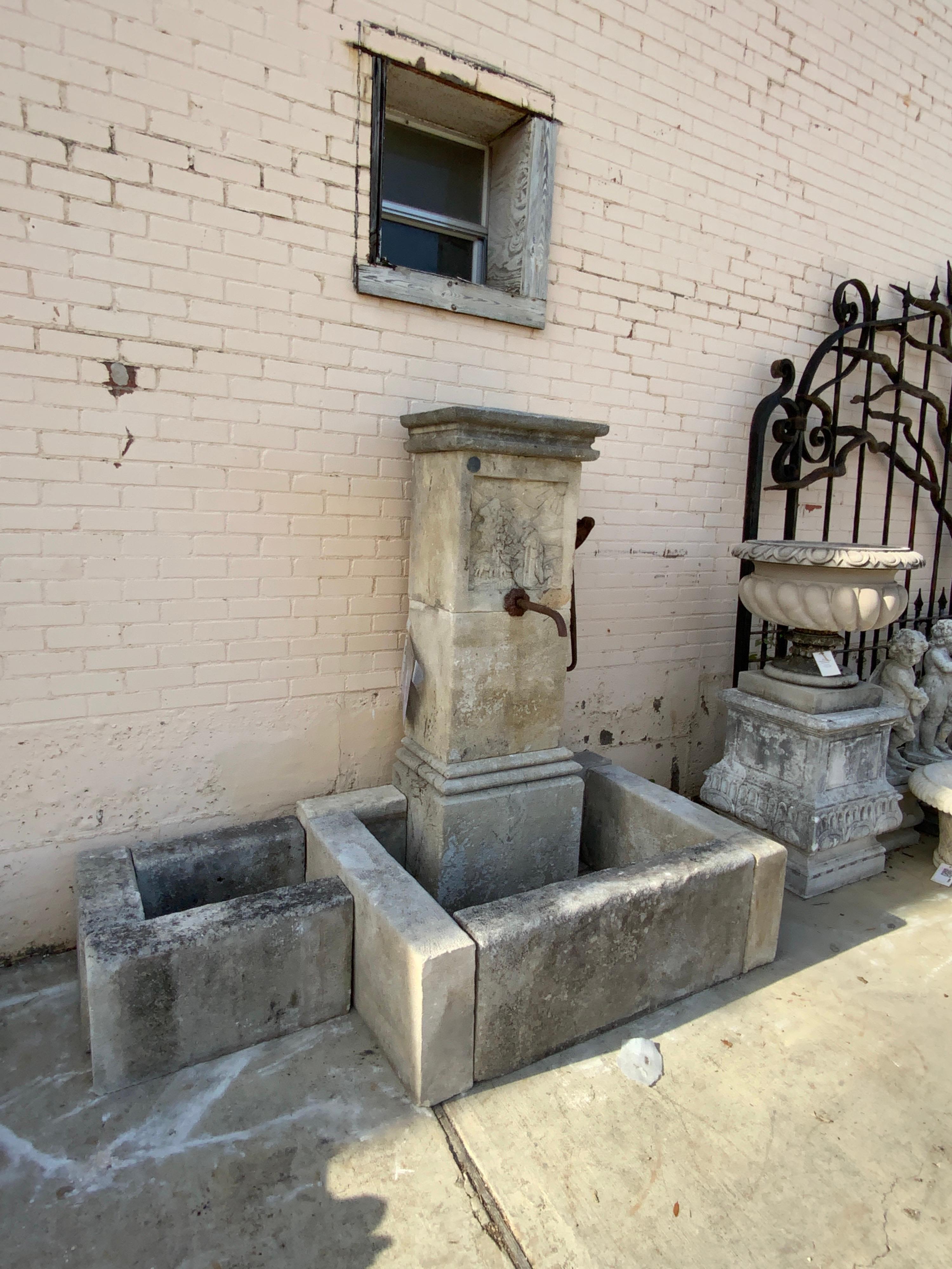 Gorgeous limestone fountain dating back to the 1850s. This item features antique pump and two basin areas. Origin; France.