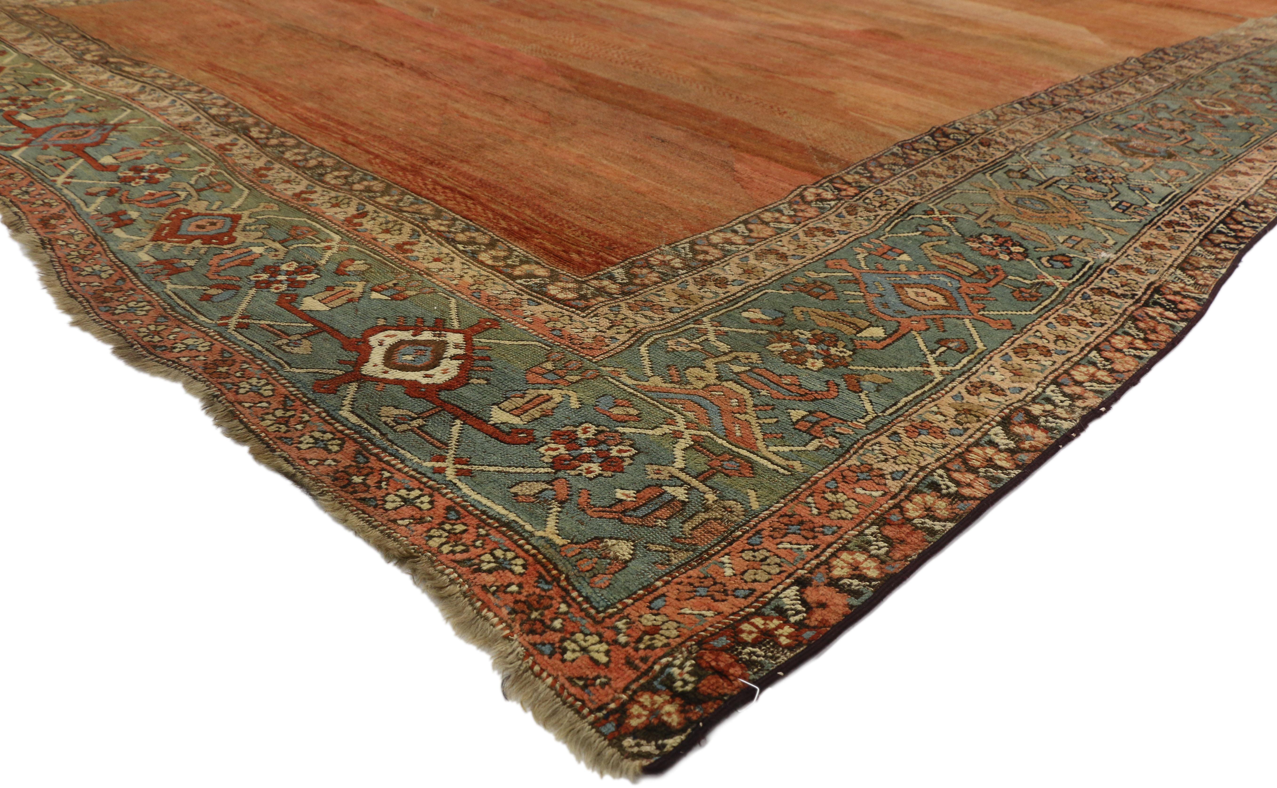 73994 Mid-19th Century Antique Persian Bakshaish Rug with Rustic Mediterranean Style. This hand-knotted wool antique Persian Bakshaish rug features a beautifully abrashed field with rust, brick red, and terra cotta striations highlighting its